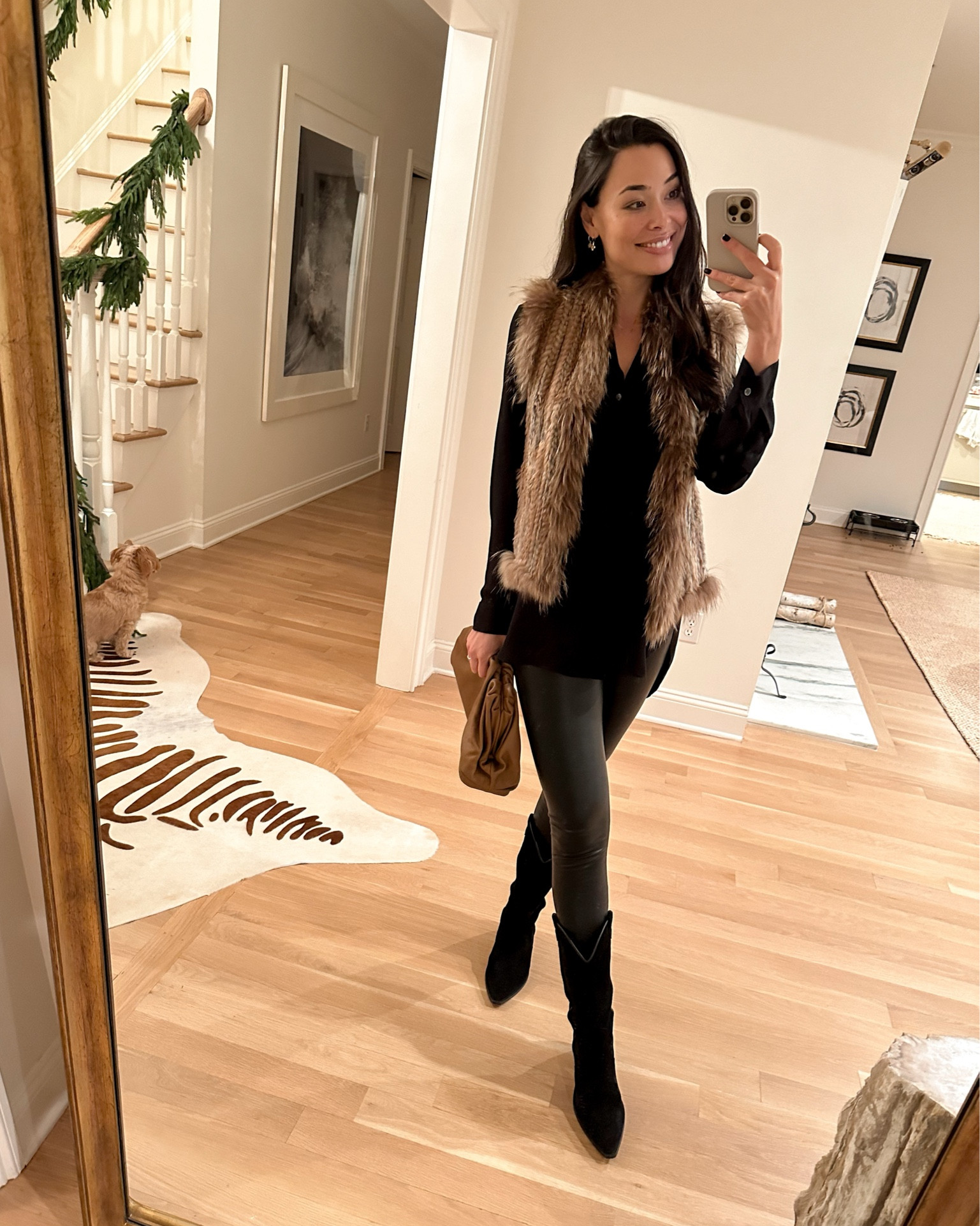 Kat Jamieson wears a fur vest (old, similar below), Theory blouse (old, similar below) and leather leggings with cowboy boots for date night. Winter outfit, Bottega Veneta. 

#LTKshoecrush #LTKitbag #LTKSeasonal