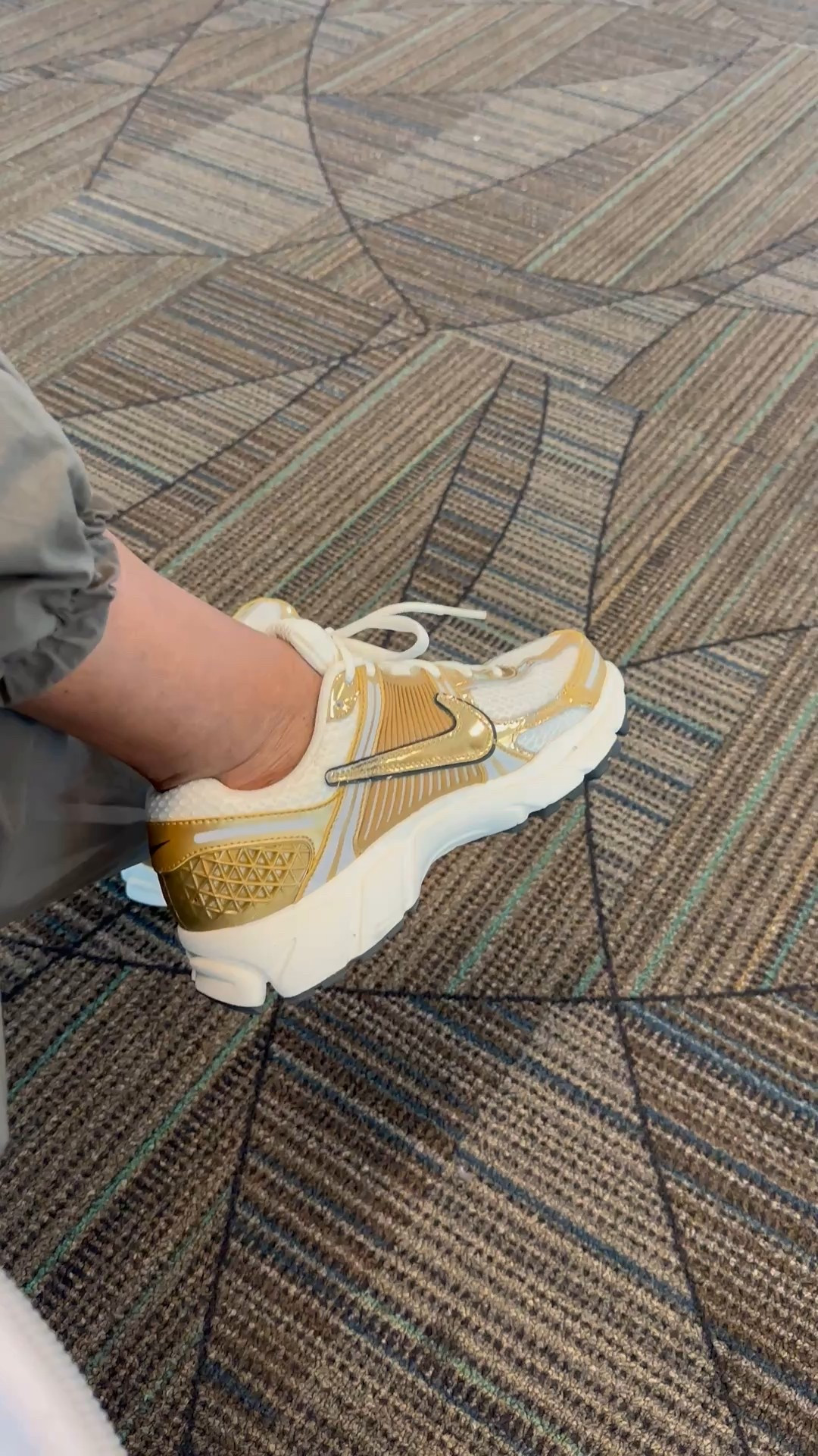 Nike gold and white sneakers 
When you arrive at the airport and change to your sneakers 

#LTKdayinmylife #LTKTravel #LTKootd