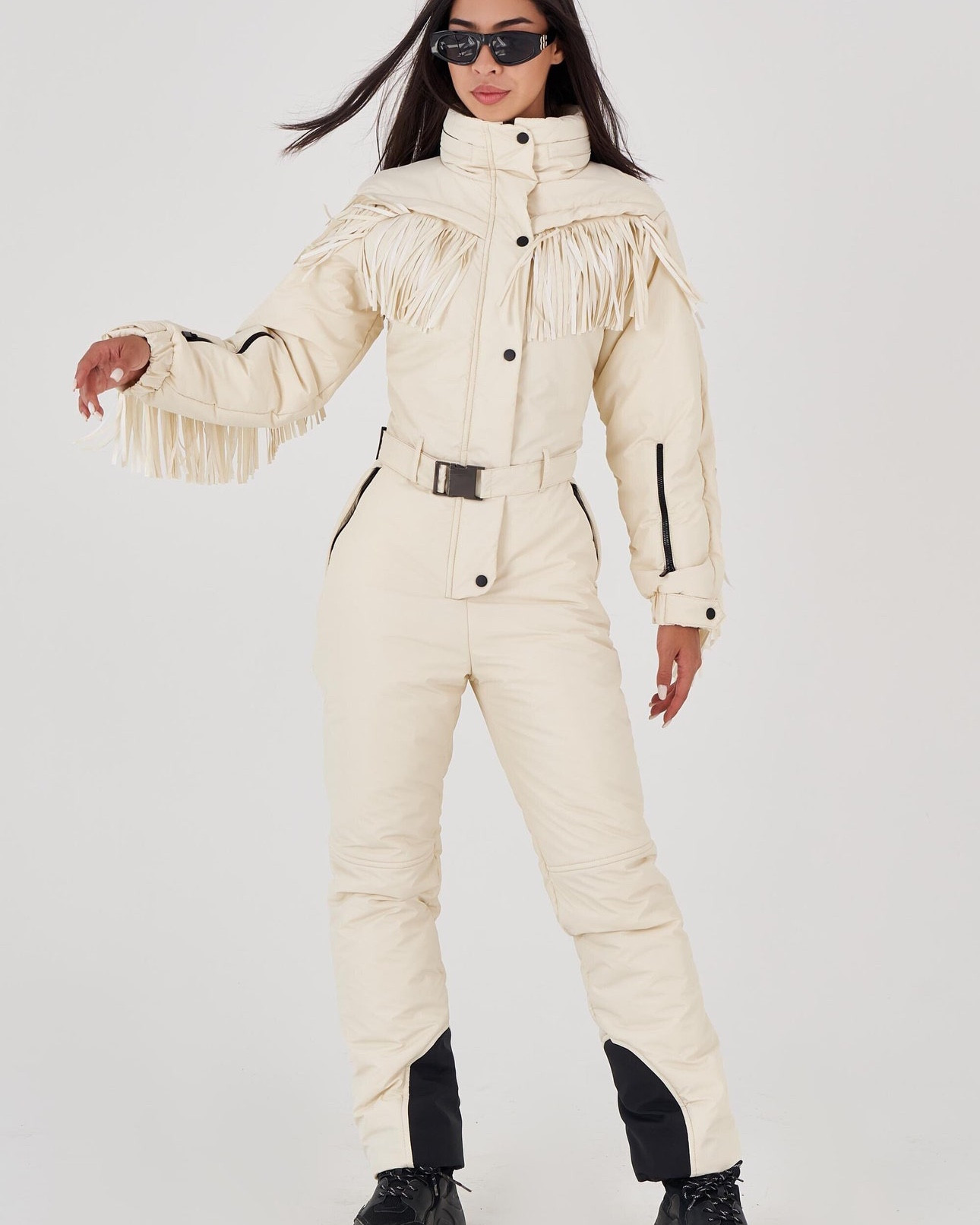 Hit the slopes in style with this ivory fringe ski suit, a one-piece winter snowsuit designed to turn heads on and off the mountain ❄️⛷️ Featuring bold fringe detailing, a sleek silhouette, and all-in-one warmth, this retro-inspired ski jumpsuit is perfect for après-ski glam or snowy adventures. Functional yet fashionable, it’s a must-have for winter getaways, snow parties, or chalet lounging in style.