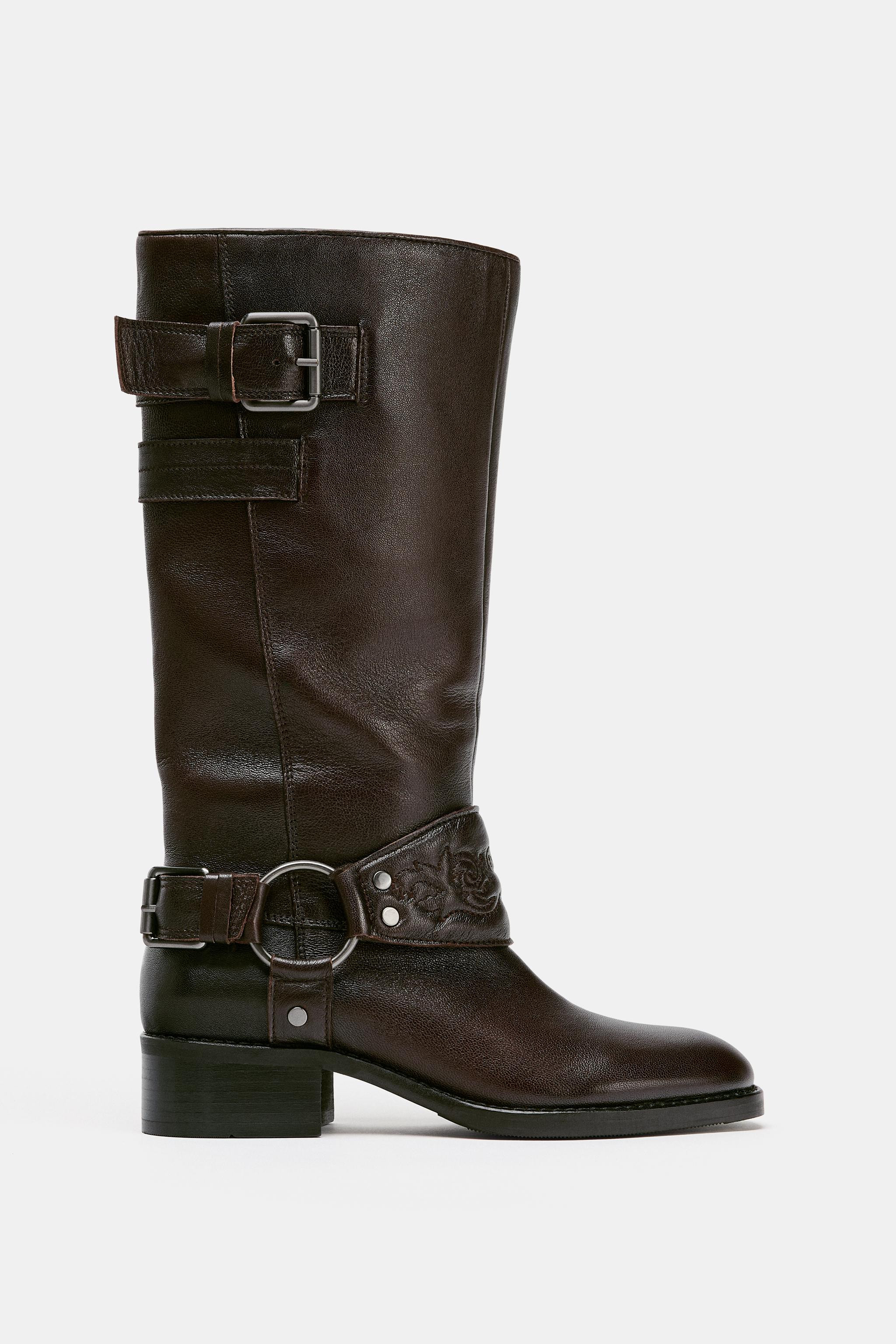 High-shaft leather boot. Strap detail with spur on the front. Double strap with buckle on the sha... | Zara US
