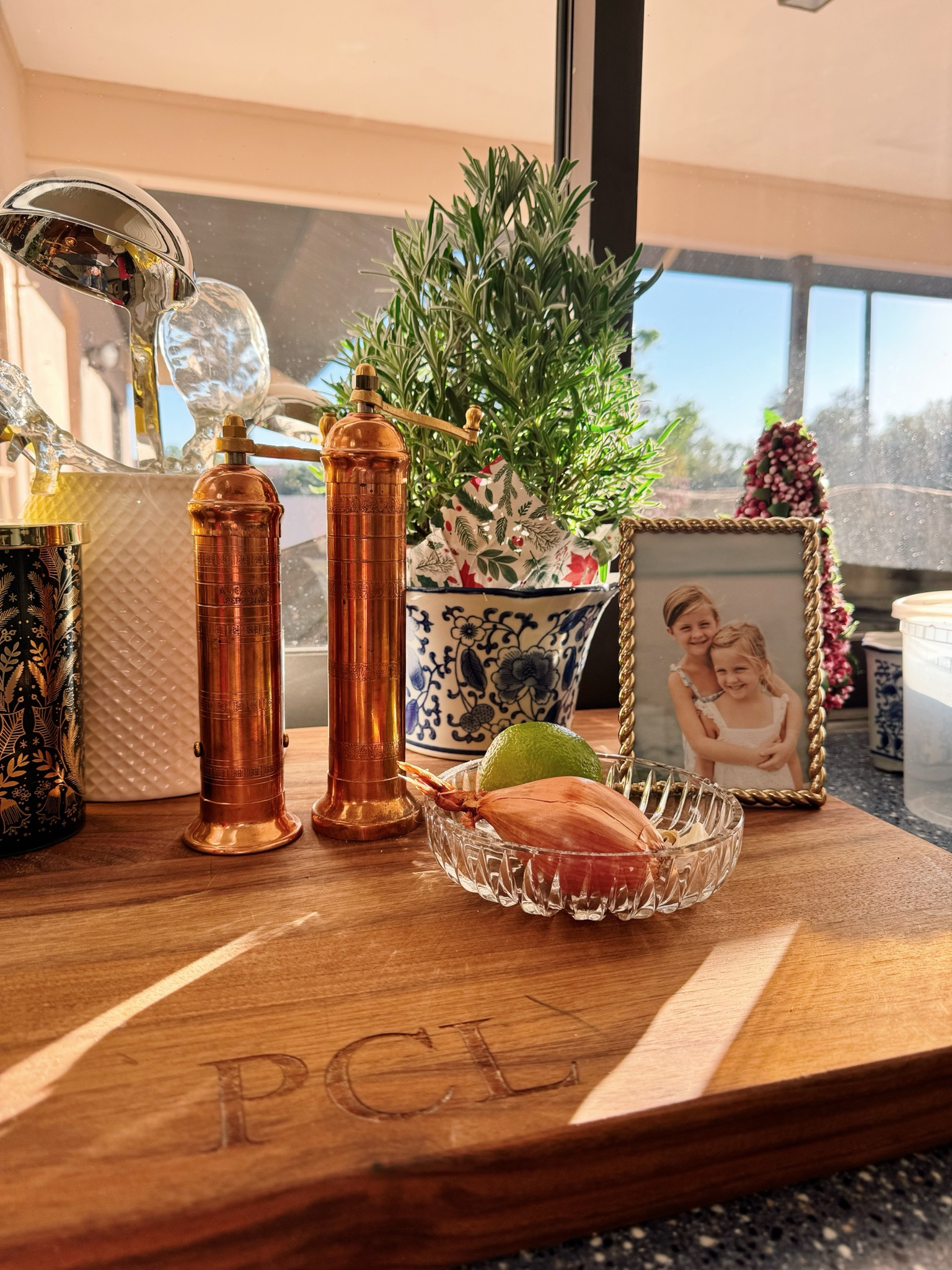 This cozy corner of my kitchen holds some of my favorite things: stunning copper salt and pepper shakers that would make a thoughtful gift for any cook, and a beautiful walnut cutting board that adds warmth to the space. But my favorite detail is the cherished photo frame, filled with a moment that reminds me of the love and joy that truly make a house a home.

#LTKHome #LTKGiftGuide #LTKCyberWeek