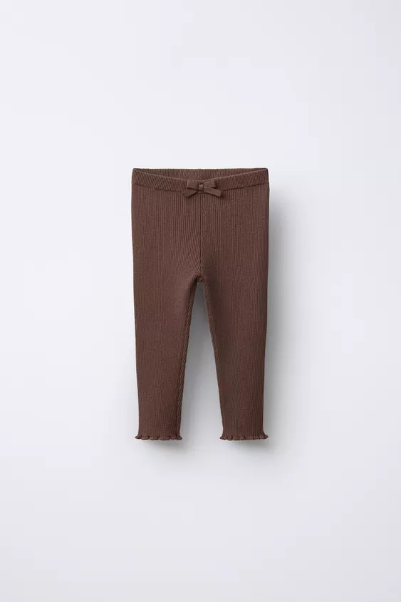 Knit leggings with elastic waistband and front bow appliqué. Ruffled hem. | Zara Canada