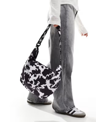 Pieces XL bumbag in black and white cow print | ASOS (Global)