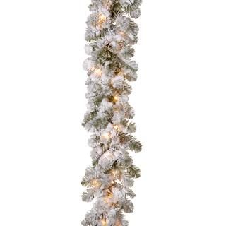 9' x 12" Pre-lit Feel Real® Snowy Camden Artificial Christmas Garland with 50 Clear Lights | Michaels Stores