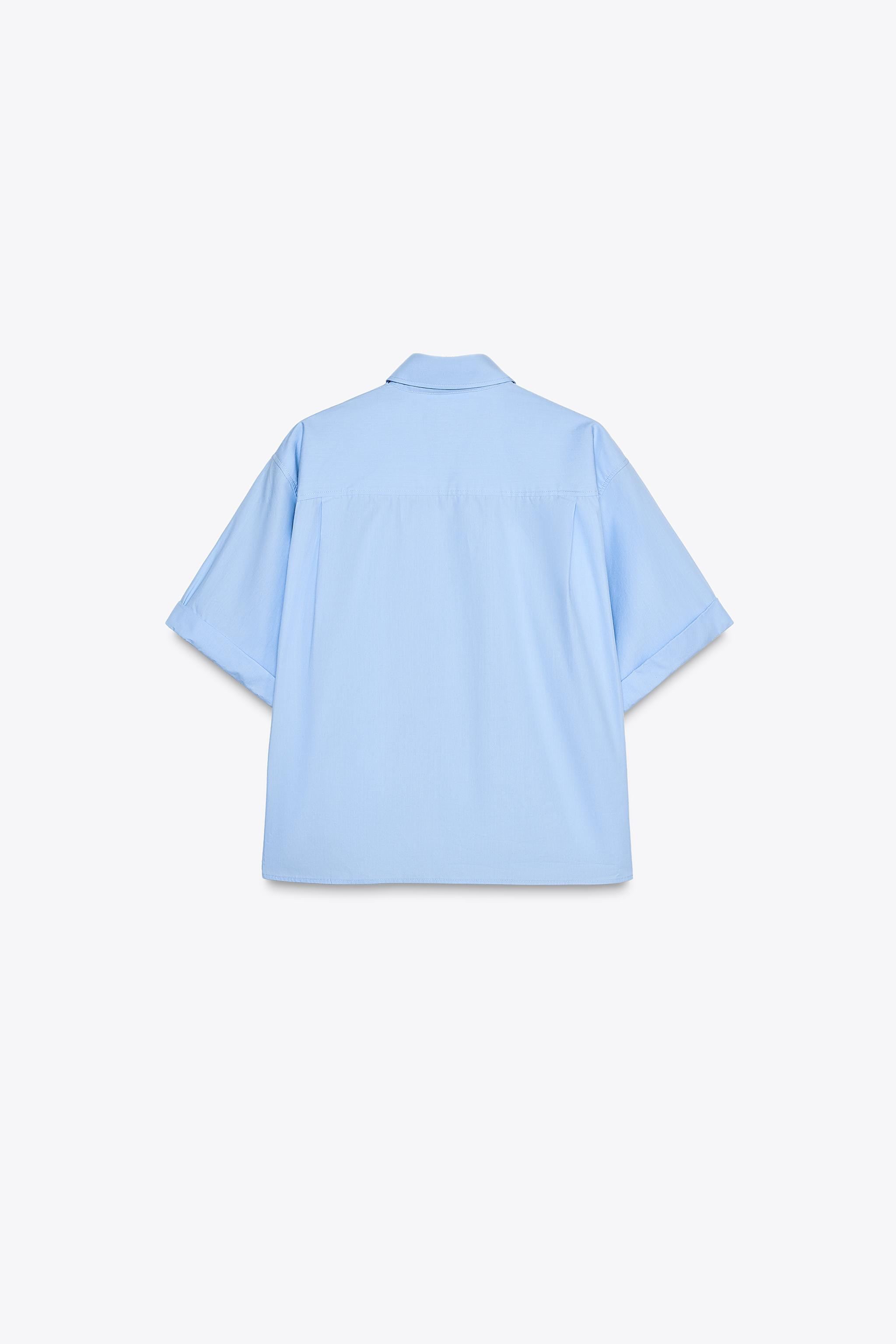 Shirt with lapel collar and short turned-up sleeves. Chest patch pocket. Darts at back. Front but... | Zara US