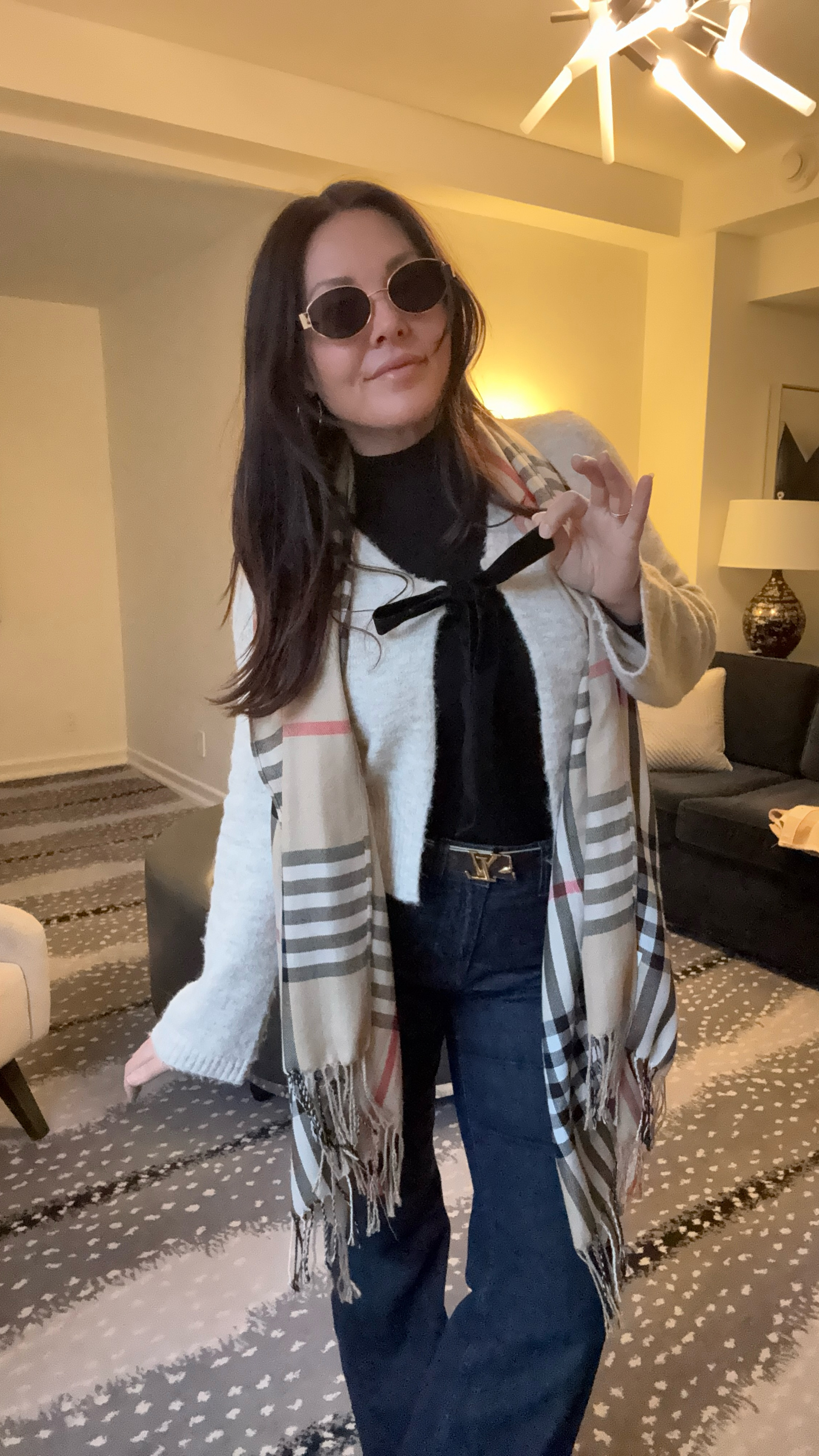 Walking around rainy NYC today. Turtleneck layered with a front bow tie cardigan, scarf, and of course hooded puffer jacket. I’ve had mine for years. 
Dark trouser jean 
LV belt
Comfy Sneakers 
Designer inspired sunglasses 

#LTKSaleAlert #LTKTravel