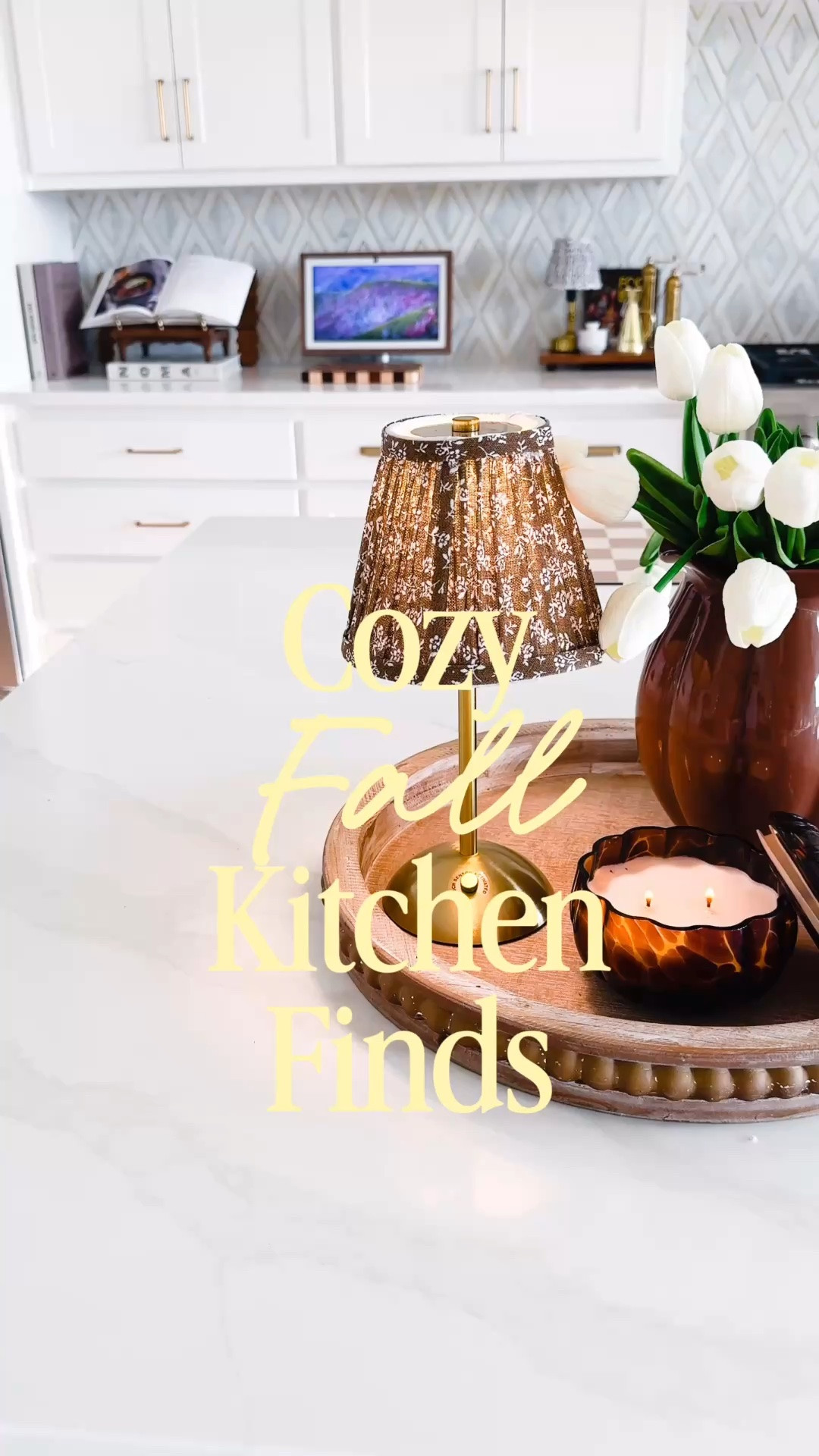 A few cozy fall kitchen finds completely changed this little corner of my kitchen. 🤎 

I mixed warm brown tones, soft lighting, white tulips and a glowing candle to create an easy fall kitchen vignette without adding a ton of seasonal decor. I love how the brown vase, floral lamp shade and tortoise-style candle bring warmth into my otherwise neutral kitchen, and some of these pieces are Walmart finds! Such an easy way to add cozy fall decor to a kitchen island, countertop or dining space while still keeping everything neutral and elevated.

Linking everything I can from this fall kitchen setup, including the Walmart home finds and similar pieces! 🍂

#LTKHome #LTKxWalmart #LTKSeasonal
