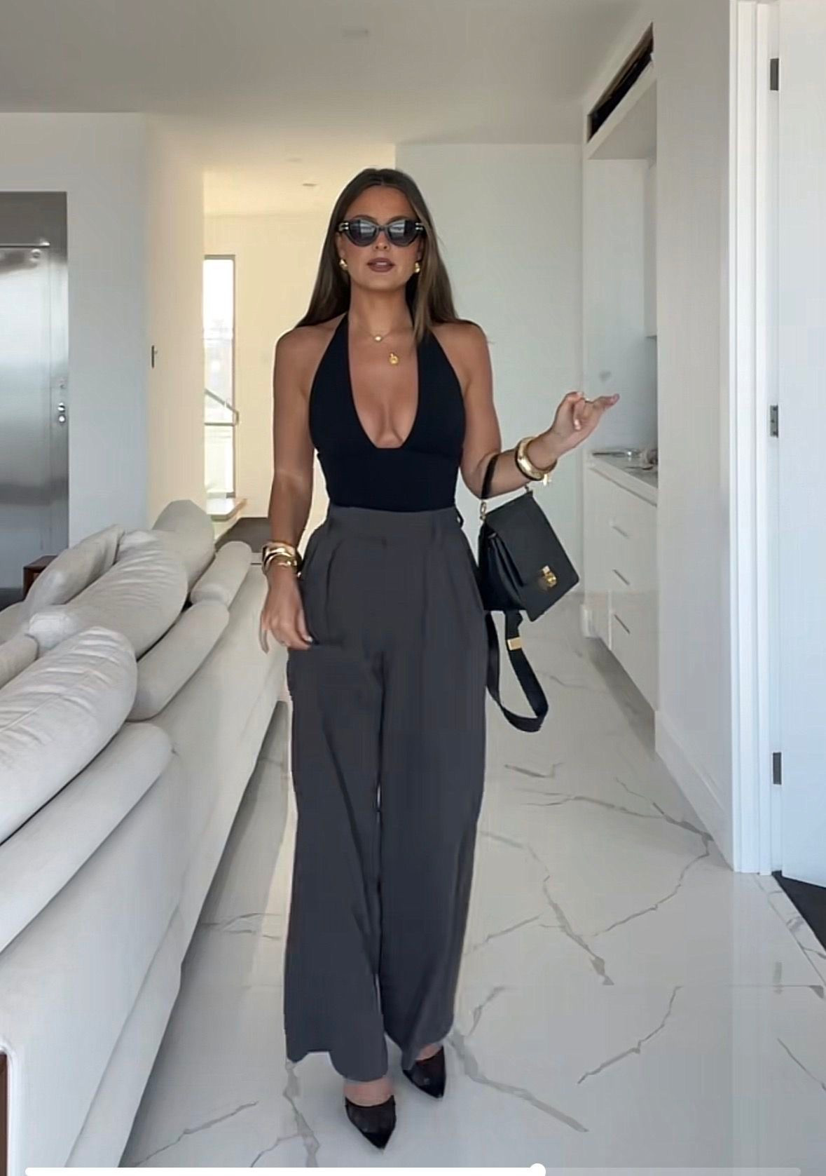Black halter top
Gray pants

#LTKootd #LTKPetite #LTKTravel