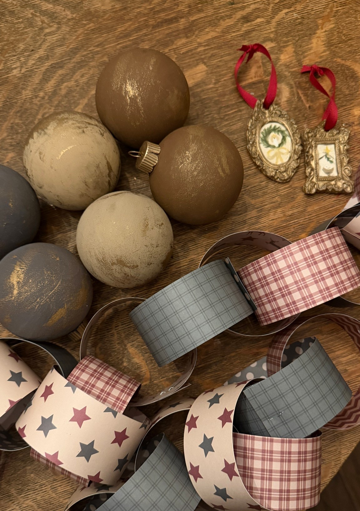 Everything we used for our DIY antiqued ornaments 🤎 We mixed the paint with a little baking soda to give it that textured look, then did 2–3 coats on each one. I mixed the blue and brown until I got the exact blue I loved, and we finished them off with a little Rub ’n Buff — also on the hooks too! 

#LTKHome #LTKHoliday #LTKSeasonal