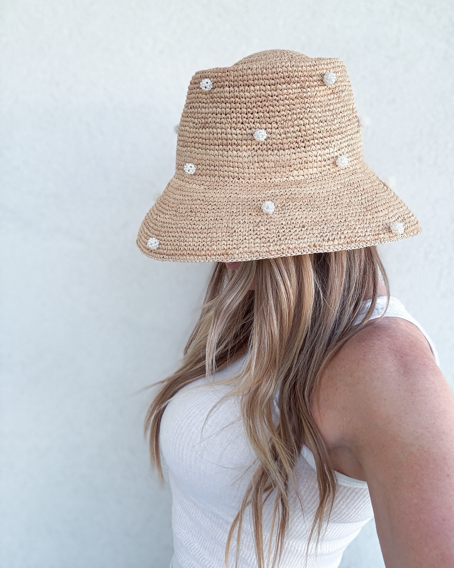 Sun protection but make it fashion. This pearl-dotted straw bucket hat is giving coastal cool meets glam grandma in the best way possible. It’s the unexpected summer accessory that instantly upgrades a swimsuit or denim shorts moment. Light, breezy, &  just enough drama. Also comes in a gorgeous dark brown color (tagged).
Wearing the viral Hanes boys ribbed tees in size boys 8-10. 

pearl straw bucket hat – summer outfit accessory – beach hat with pearls – coastal cowgirl style – glam sun protection – playful straw hat – trendy summer hat – girly beachwear – neutral vacation accessories – statement sun hat – summer glam outfit – fun summer hat – beach day outfit idea – straw hat with embellishments – resort style accessory - Anthropologie 

#LTKSummerEdit #LTKStyleTip #LTKSwim