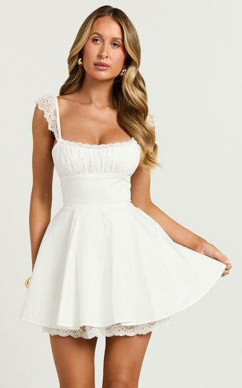 Adalee Mini Dress - Sleeveless Ruched Bodice Lace Trim Dress in Off White | Showpo (US, UK & Europe)