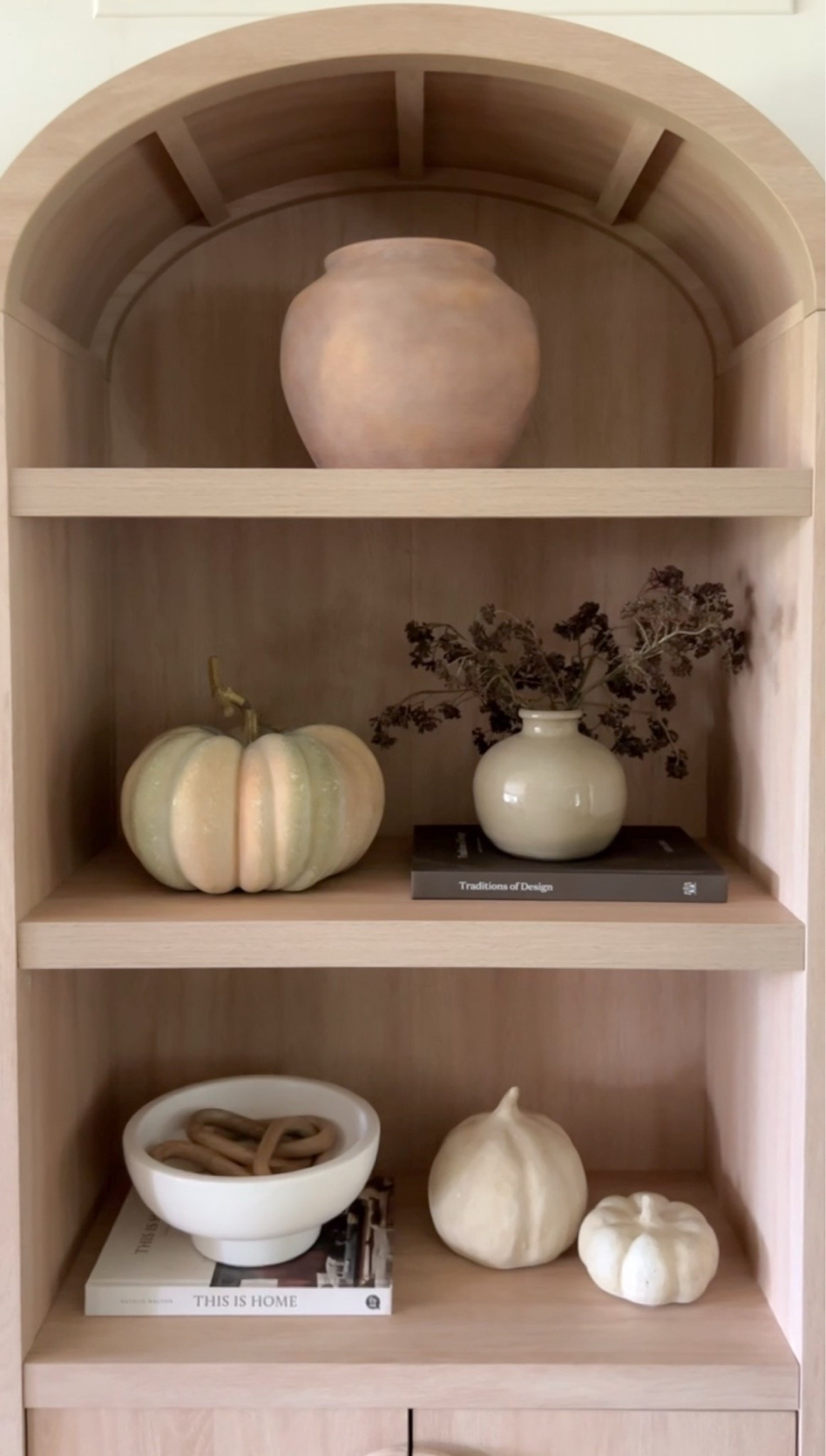 Neutral fall decor in my arched bookcase 🍂

#LTKSeasonal #LTKHome