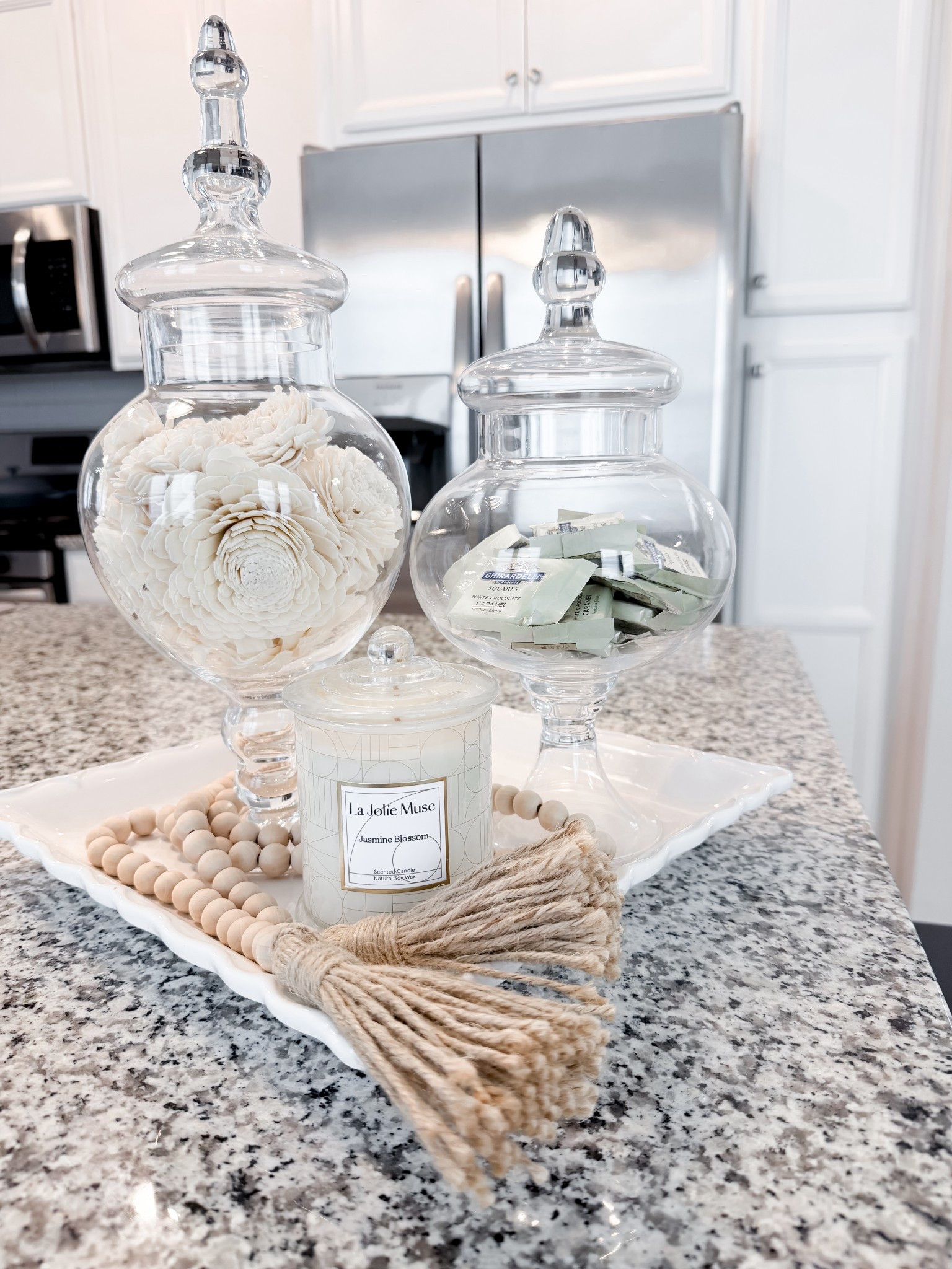 Clean, classic, and the easiest way to elevate a space 🤍

This decorative white tray + apothecary jars instantly made my counter feel styled and pulled together. Simple pieces, big impact.

#LTKhome #LTKstyletip #HomeStyling #NeutralHome #HomeDecorFinds #LTKfinds #DecorInspo #ShelfStyling #BathroomDecor #ClassicHome