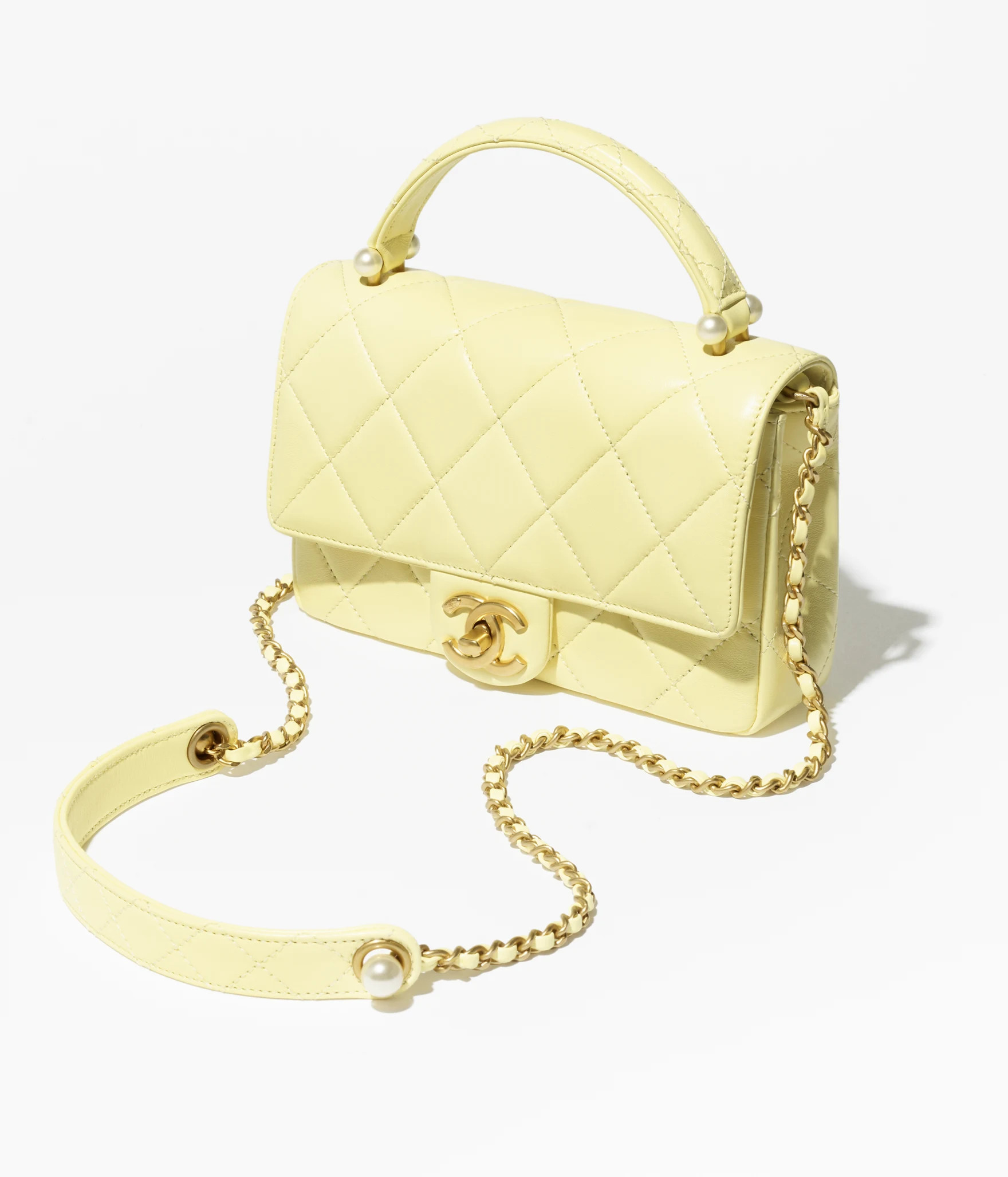 Mini flap bag with top handle, Shiny lambskin, imitation pearls & gold-tone metal, light yellow ... | Chanel, Inc. (US)