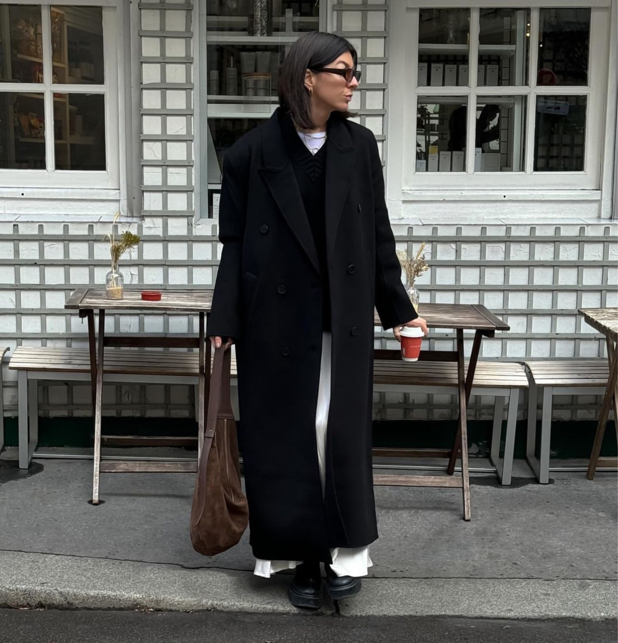 Long black coat, white maxi skirt, chunky zip up boots, cashmere jumper, suede curved tote bag

#LTKstyletip #LTKSeasonal #LTKeurope