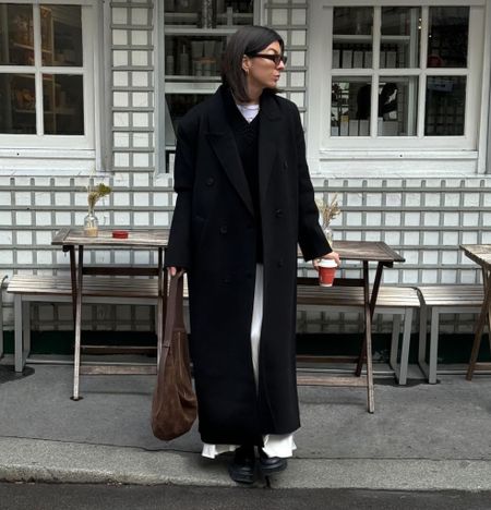 Long black coat, white maxi skirt, chunky zip up boots, cashmere jumper, suede curved tote bag

#LTKstyletip #LTKSeasonal #LTKeurope