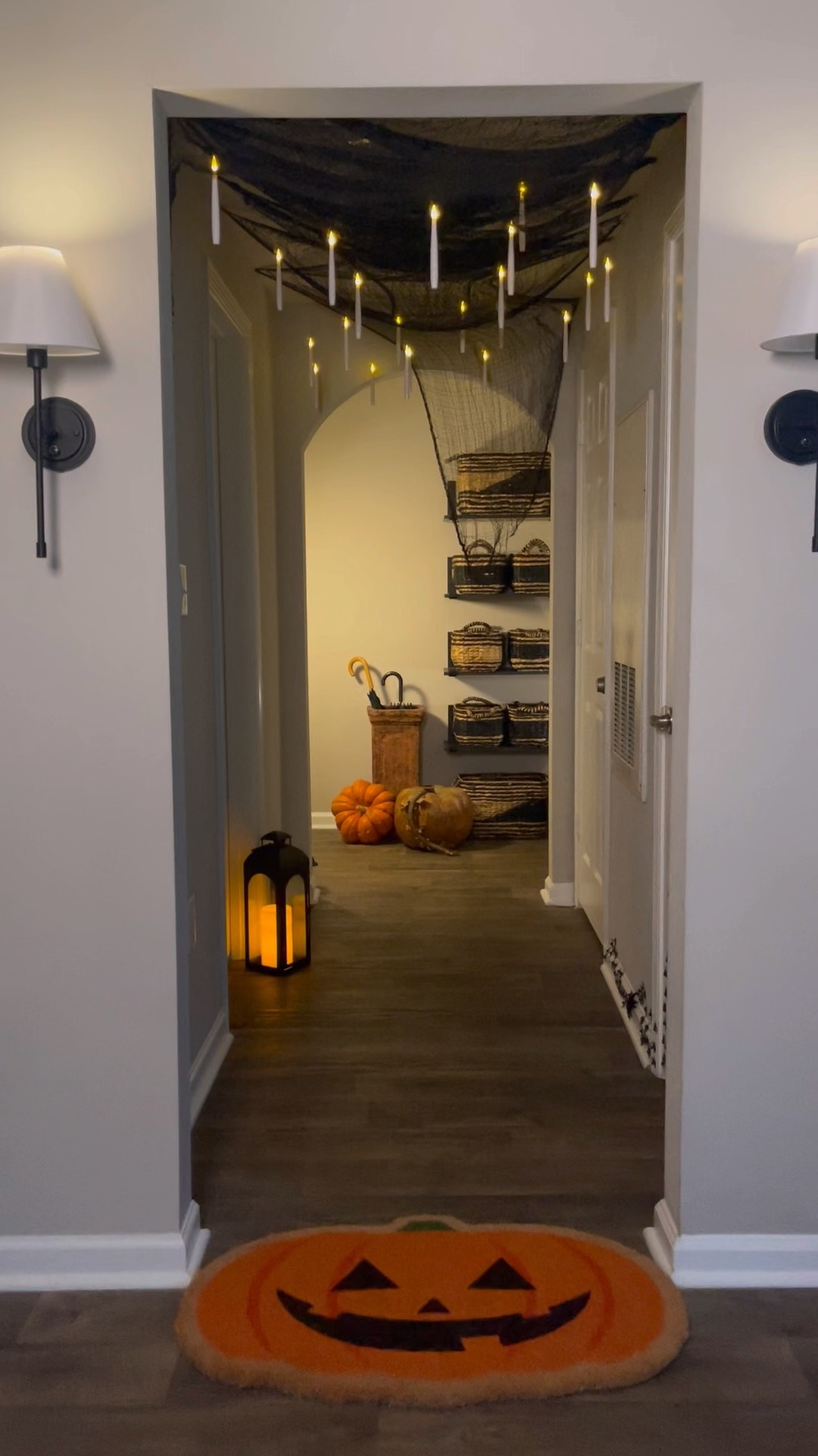 A plain hallway turned into a Halloween scene 🎃 With one wave of the wand, floating taper candles and crawling spiders appear. These flameless LED candles are perfect for spooky season — they even come with a wand remote. I love how they make the space magical, festive, and cozy for fall, and you can keep them up through Christmas by switching the vibe.

Halloween decorations, cozy lighting, floating candles, ambiance lights — such a fun way to transform your home for the season.

#LTKHome #LTKSeasonal