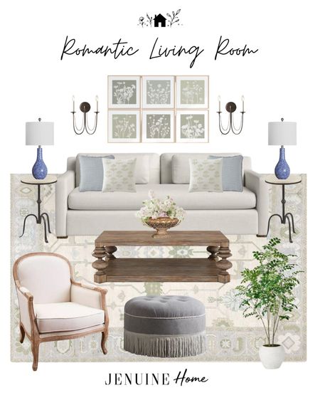 Romantic living room. Coastal living room. White couch. Traditional living room. Light blue Green throw pillow. Off white throw pillow. Wooden coffee table. Grey tufted Ottoman. White French country armchair. Faux tree. Light traditional living room. Blue lamp. Black metal side table. Black romantic sconce. Gallery art. Faux lilac. Gold dish  