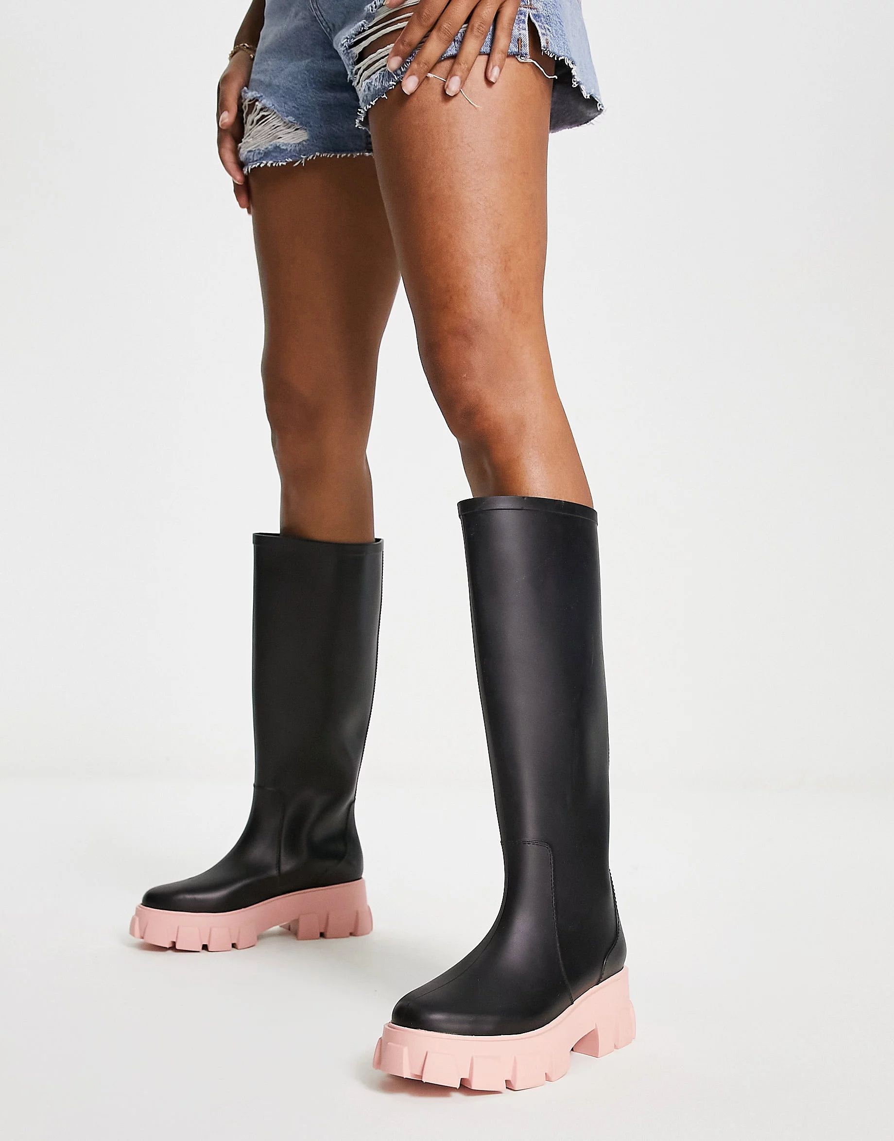 ASOS DESIGN Gracie chunky knee high wellies in black with pink sole | ASOS (Global)