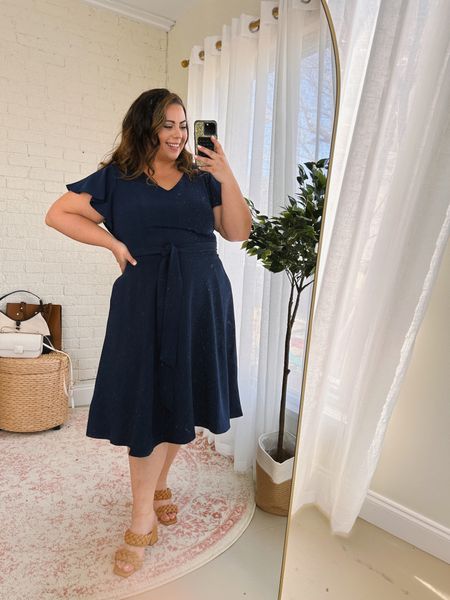 This stunning plus size dress is perfect as a spring wedding guest outfit or for the office - True ti size Wearing 20 