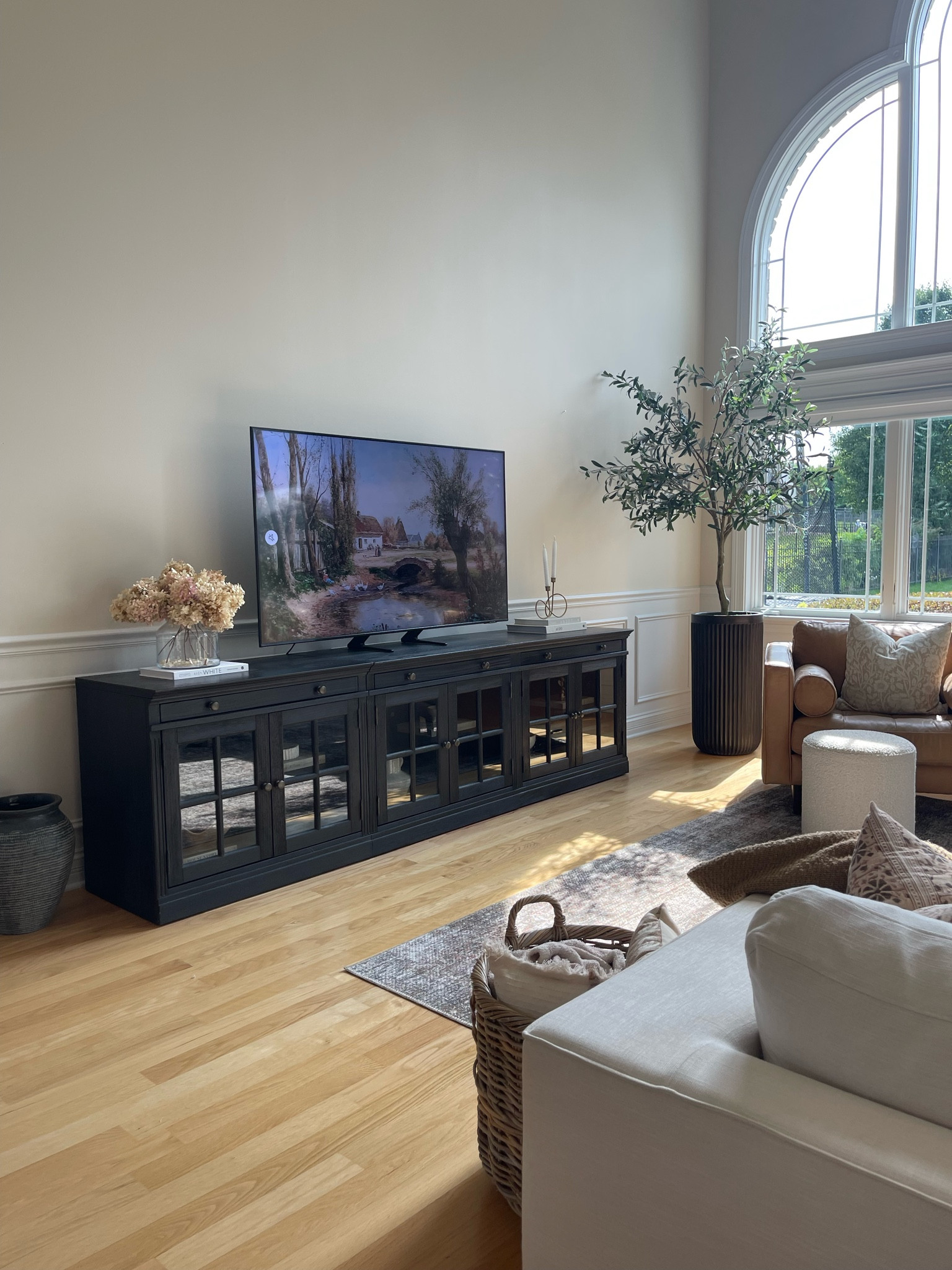 Our media console is one of my favorite purchases for our Great room! I love that you can continue to build onto it if you want, and I also love how elegant, and beautiful it looks. 

Pottery Barn, media console, tv media console, tv media, fluted planter, faux olive tree, Great room, living room, home, home decor, 

#LTKsalealert #LTKhome #LTKFind