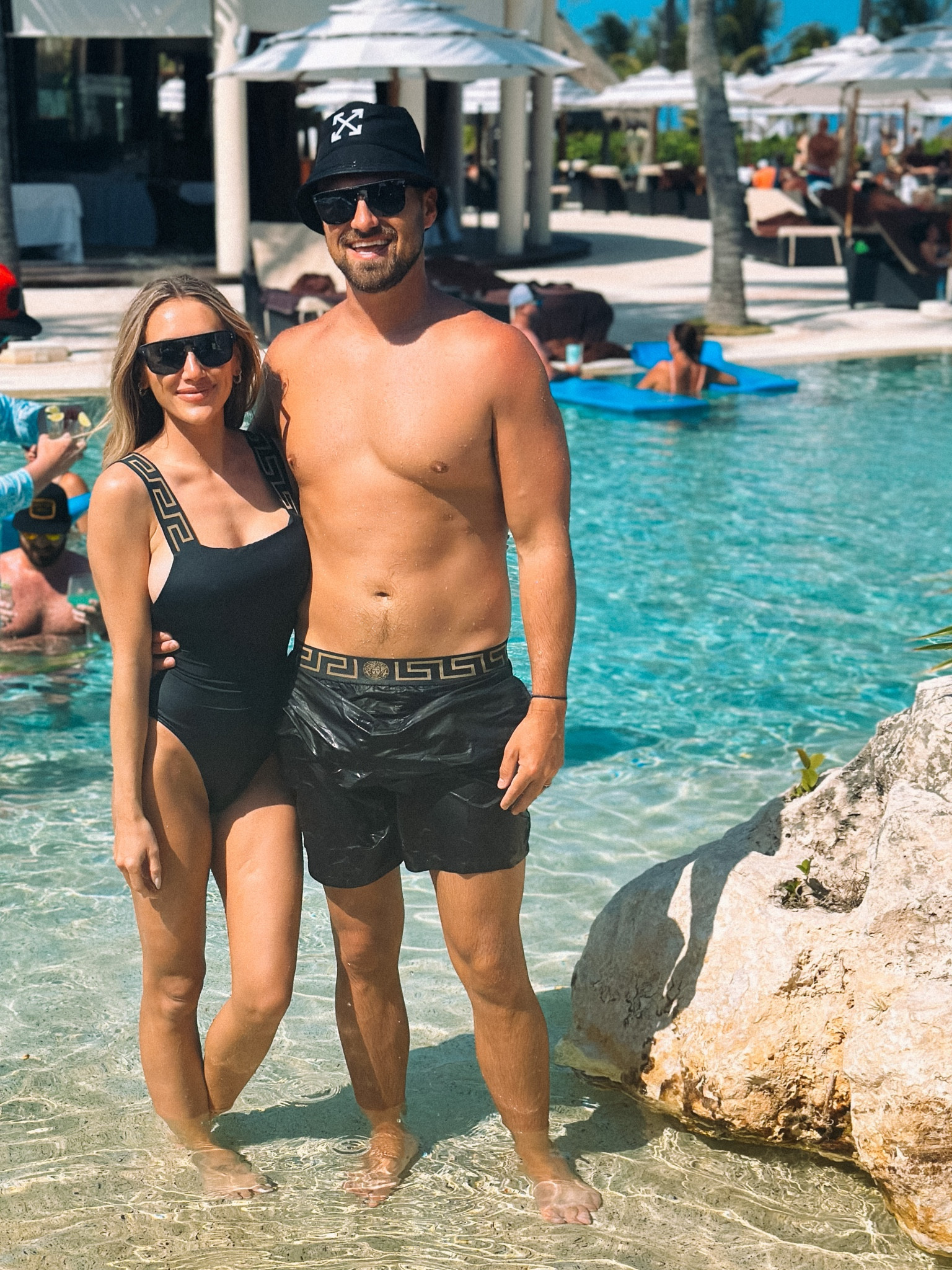 His & Hers matching black Versace swimsuits & LV sunglasses. Perfect idea for honeymoon or destination wedding. I am wearing size 1 and the suit material is thick & flattering. 