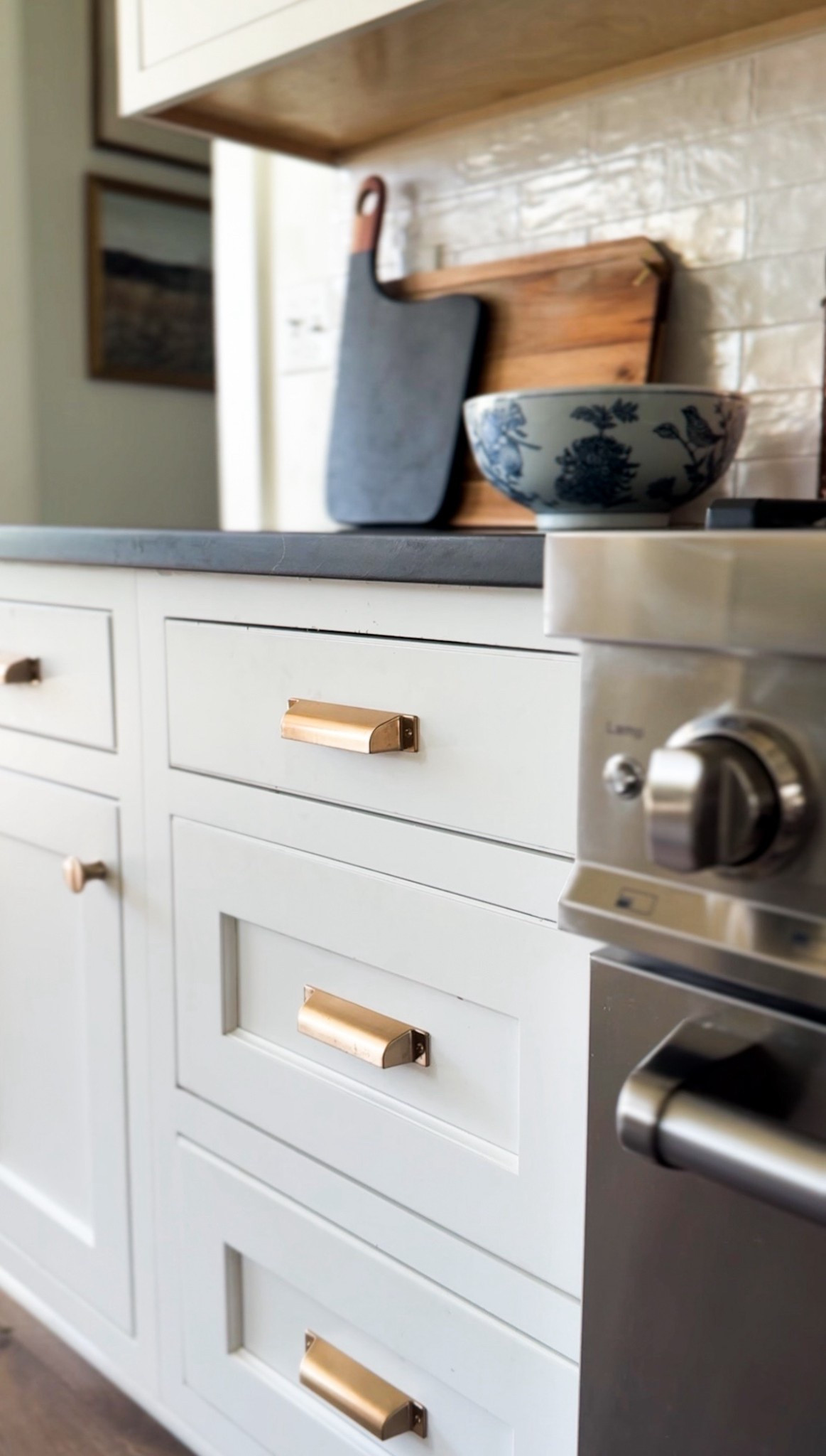 One way we warmed up our white kitchen was with a black perimeter quartz countertop and honey bronze brass look kitchen hardware. We mixed knobs on the cabinets with mission style pulls on the drawers. I’ve linked the hardware below. 

The countertop is Daltine Broadway Black quartz countertop honed

#kitchenhardware #brasshardware #topknobshardware 

#LTKHome