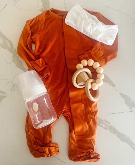 Baby orange footie paired with white bow! Love these footies because they’re magnetic and so easy to take on and off  

#LTKbaby #LTKstyletip