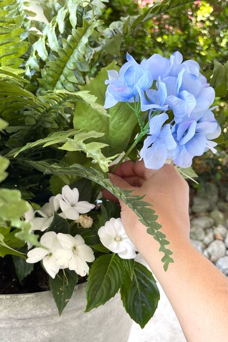 Summer flower arrangement, planter, faux ferns, faux blue hydrangeas, classic grey outdoor planter, Summer outdoor decor. 

#LTKunder50 #LTKFind #LTKhome