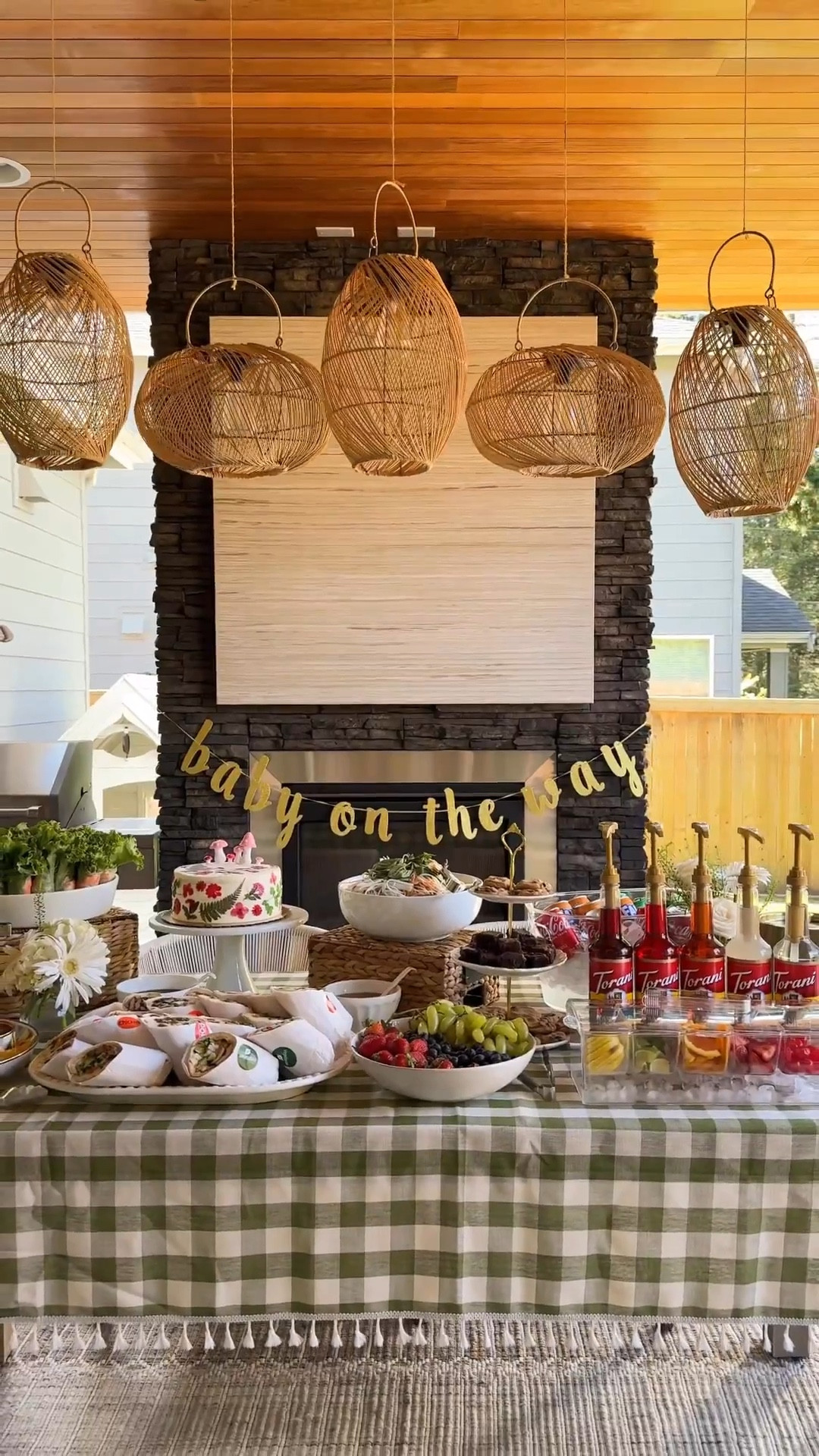 Baby shower food setup! Since the party was in the late afternoon, we went with a “light bites” spread for 14 guests (but it ended up being soo much food lol). Here’s what was on the menu:

🥖 Bánh mì
🥢 Spring rolls
🥗 Papaya salad
🍓 Fresh fruit
🍟 Chips + dip
🍪 Dessert table (cake, brownies, cookies)
🥤 Dirty soda bar

For the cake, we grabbed the Whole Foods berry chantilly cake plain and dressed it up with dried flowers. Turned out so pretty! 🍄🍃✨

Other tips: use baskets and tiered serverware to create different heights, fly fans to help keep bugs away (altho they were going crazy over the fish sauce), and get Vietnamese food from Go Catering.
#foodsetup #babyshowerfood #vietnamesefoods

Checkered Tablecloth, hanging garland, sprite, coke, beverage tub, pump dispenser, Torani drink syrup soda, dr pepper, plastic cup, cake, dried flowers, bud vases, metal ice bucket 

#LTKParties #LTKHome #LTKSeasonal
