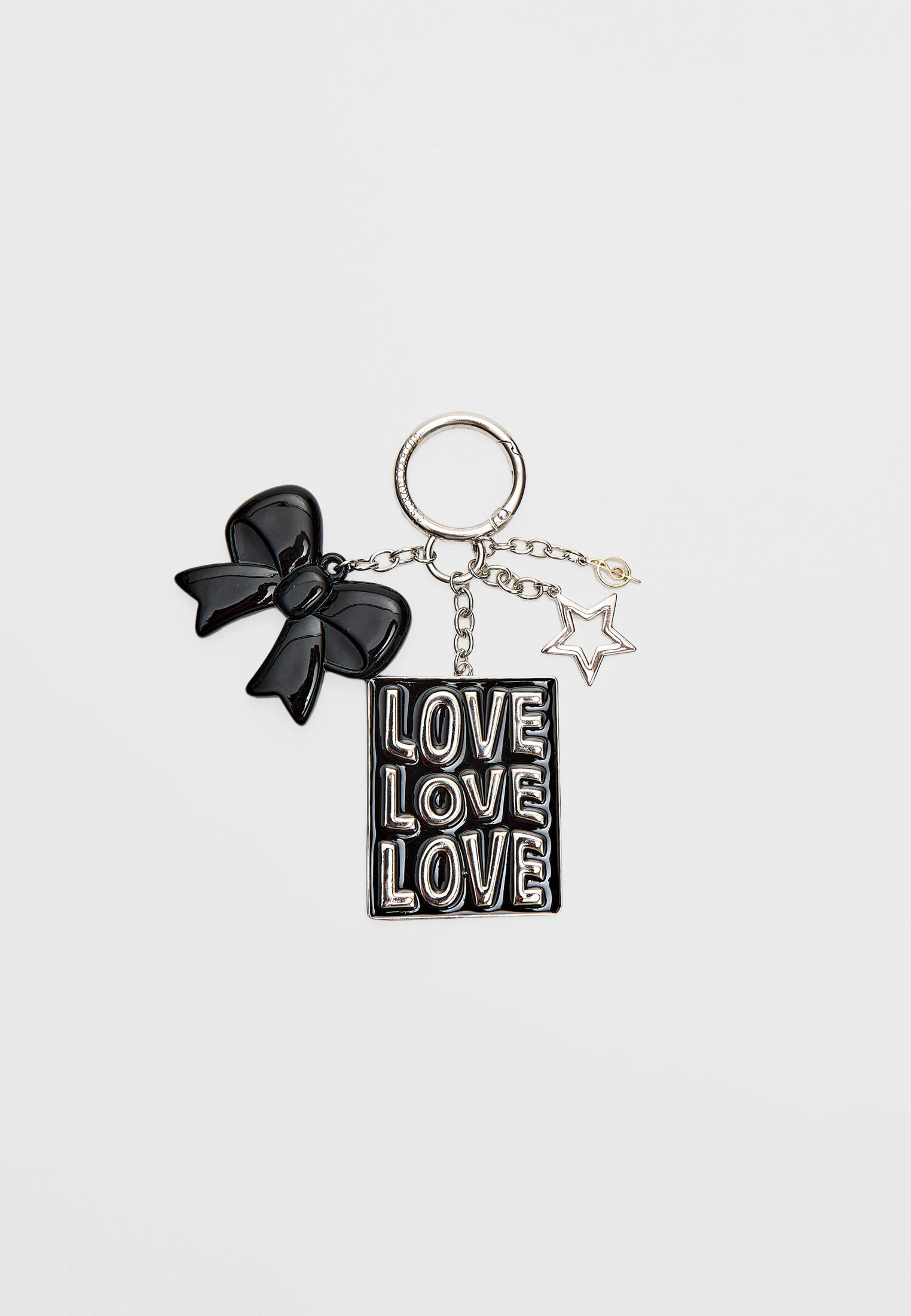 Bow and charm key ring | Stradivarius (UK)