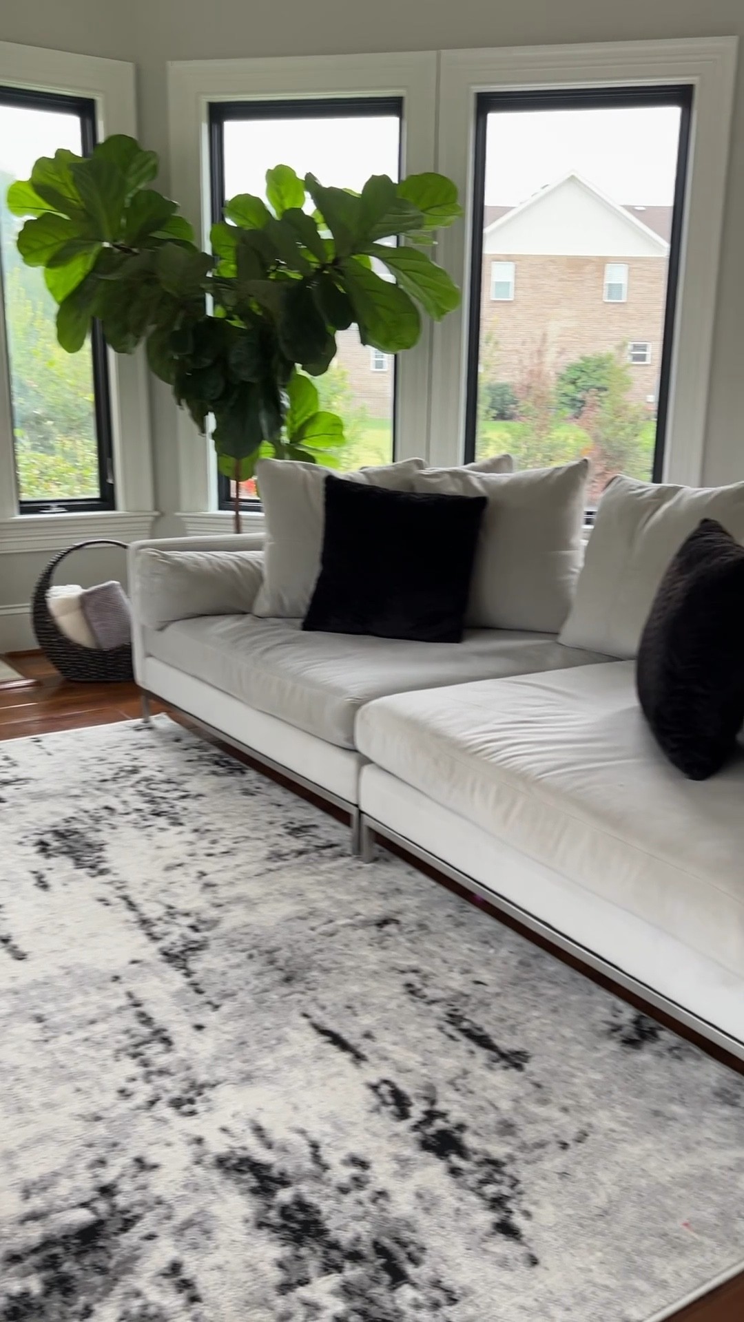 Grey couch + grey and black abstract rug. Couch is available as a standard couch or a 3 piece sectional and is currently on sale! 

#LTKhome #LTKsalealert