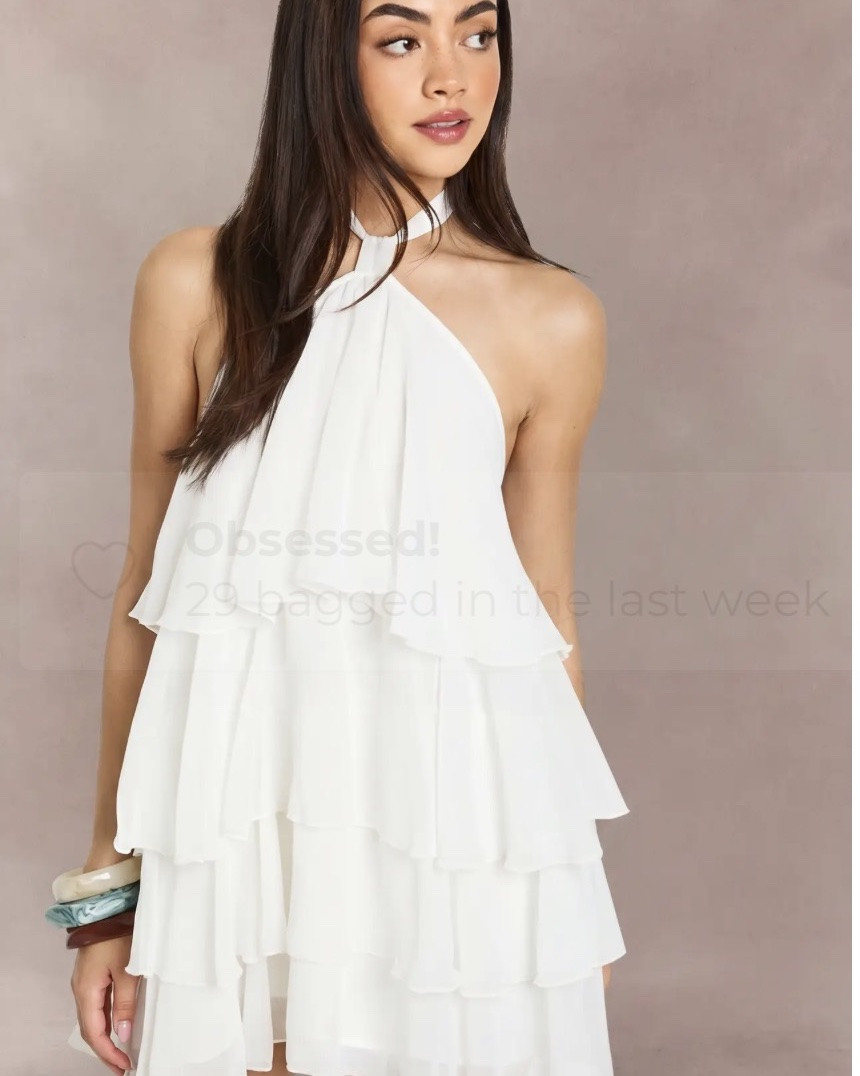 Elegant tiered chiffon layers
Flattering halterneck silhouette
Flowy lightweight fabric
Perfect mini length
Eye-catching going out dress
Description
Striking halterneck design with elegant neck fastening for a sophisticated look
Flowing chiffon fabric creates beautiful movement as you dance the night away
Tiered construction adds dimension and visual interest to this statement mini
Sleeveless silhouette showcases shoulders and arms for a flattering effect
Relaxed fit through the body offers comfort without compromising on style
Make an entrance in this show-stopping chiffon mini dress that combines effortless style with head-turning appeal. The distinctive halterneck design frames your décolletage beautifully, while the playful tiered structure creates captivating movement with every step. Perfect for nights out on the town, this dress pairs brilliantly with strappy heels and statement bangles as shown. The lightweight, floaty fabric ensures you'll stay comfortable whilst dancing until dawn. For cooler evenings, layer with a cropped jacket and finish with a small clutch bag. Whether you're heading to a cocktail bar or meeting friends for a special celebration, this versatile piece transitions seamlessly from casual drinks to more upscale venues, making it an essential addition to your going-out wardrobe.
@boohoo

#LTKSaleAlert #LTKU #LTKdayinmylife