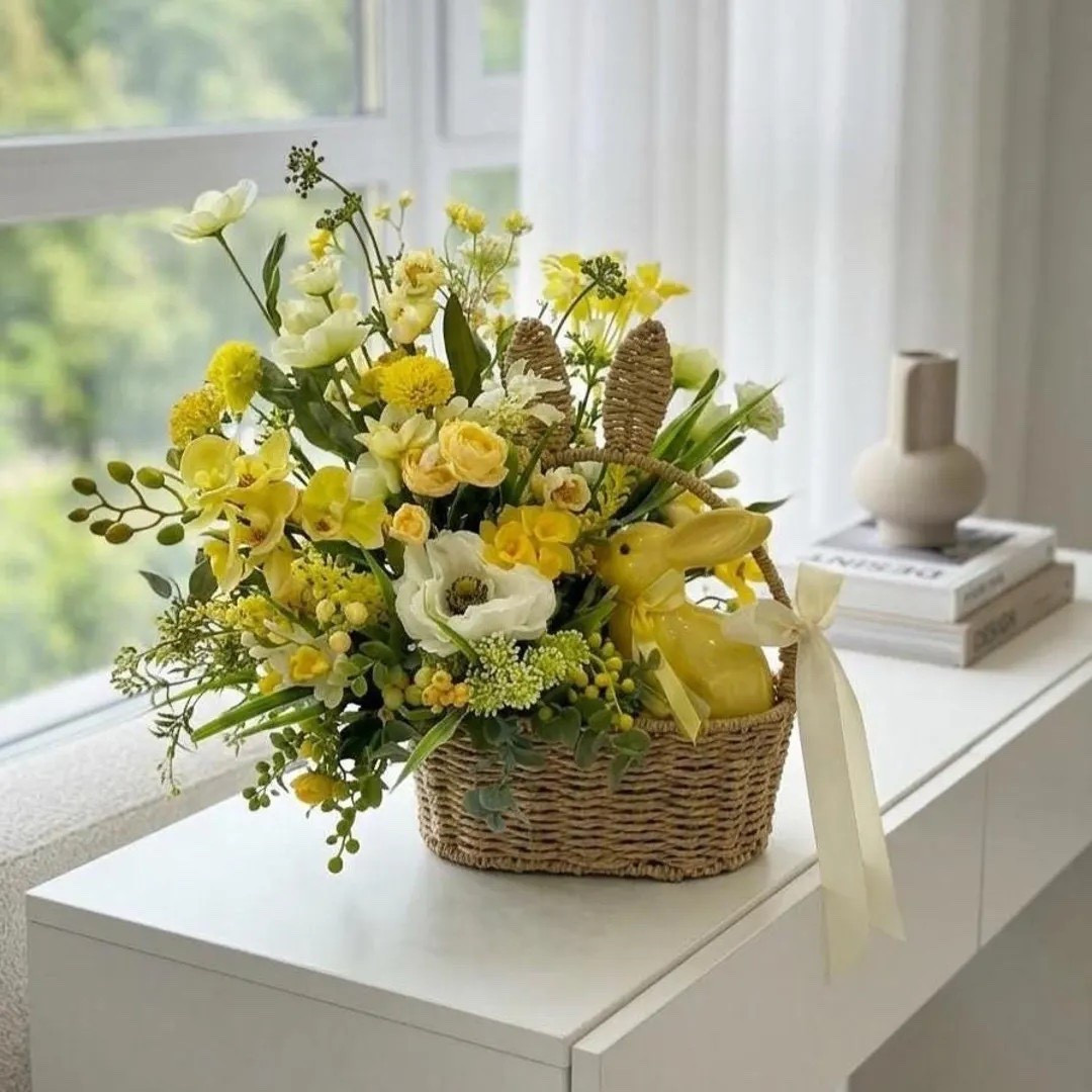 Create a warm and welcoming Easter display with this beautiful handmade centerpiece by Lozynka. Designed in a woven wicker basket, this arrangement features soft pastel artificial flowers, lush greenery, and a charming bunny accent that brings a festive springtime feel to your table. Perfect for Easter brunch, holiday gatherings, or seasonal decorating, this piece adds effortless farmhouse charm to any space.

#LTKHome #EasterDecor #SpringHomeDecor #EasterTable #FarmhouseDecor #SeasonalStyling #SpringCenterpiece #HolidayHome 

#LTKSeasonal #LTKHome