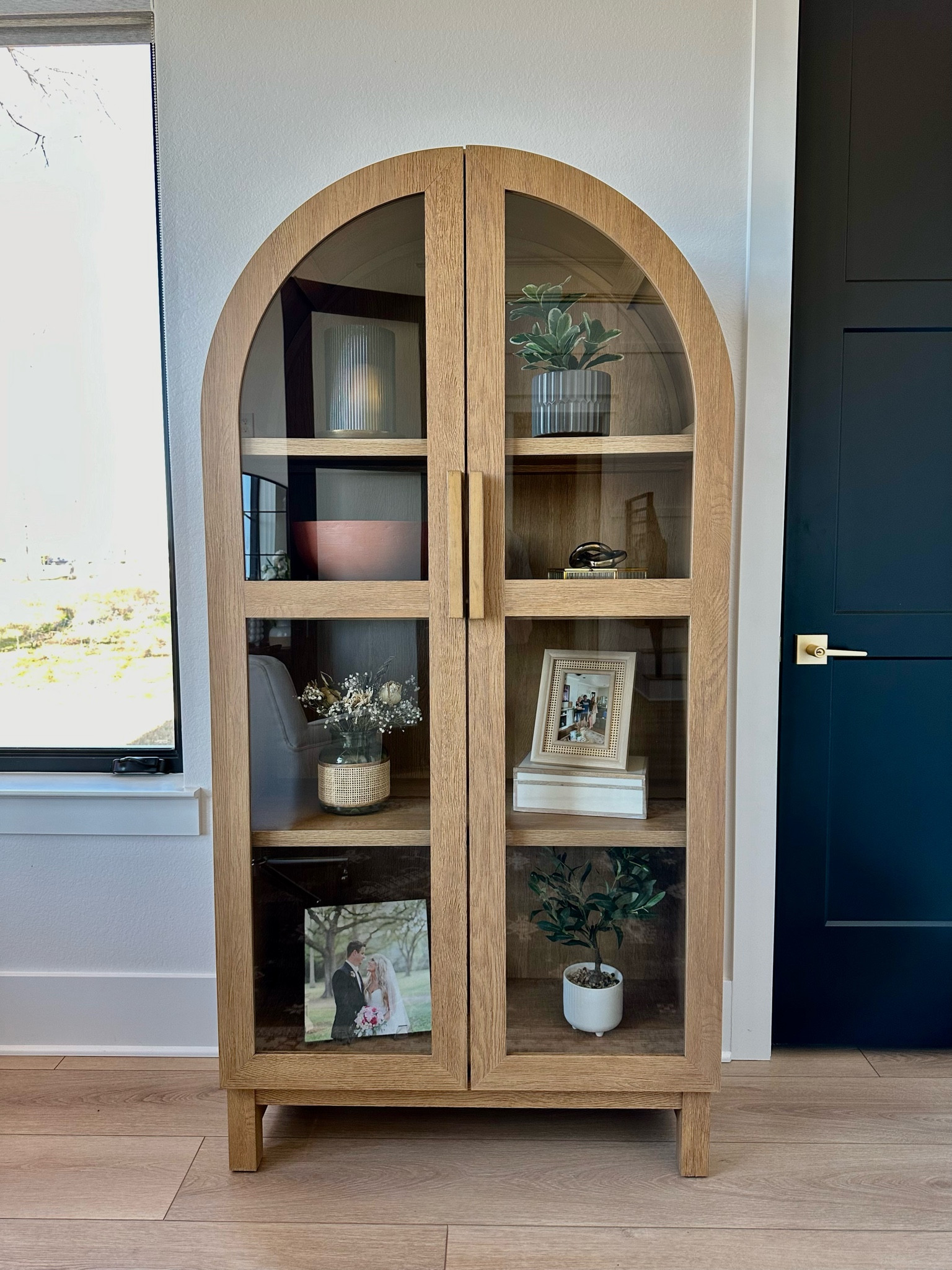 This new arch cabinet from Walmart is gorgeous and such a good price. #walmartpartner It’s the most affordable arched cabinet I’ve seen. Obsessed is an understatement! Also, loving all the new faux plants and planters from @walmart #walmarthome #walmartfinds 

#LTKhome #LTKSeasonal #LTKfindsunder50