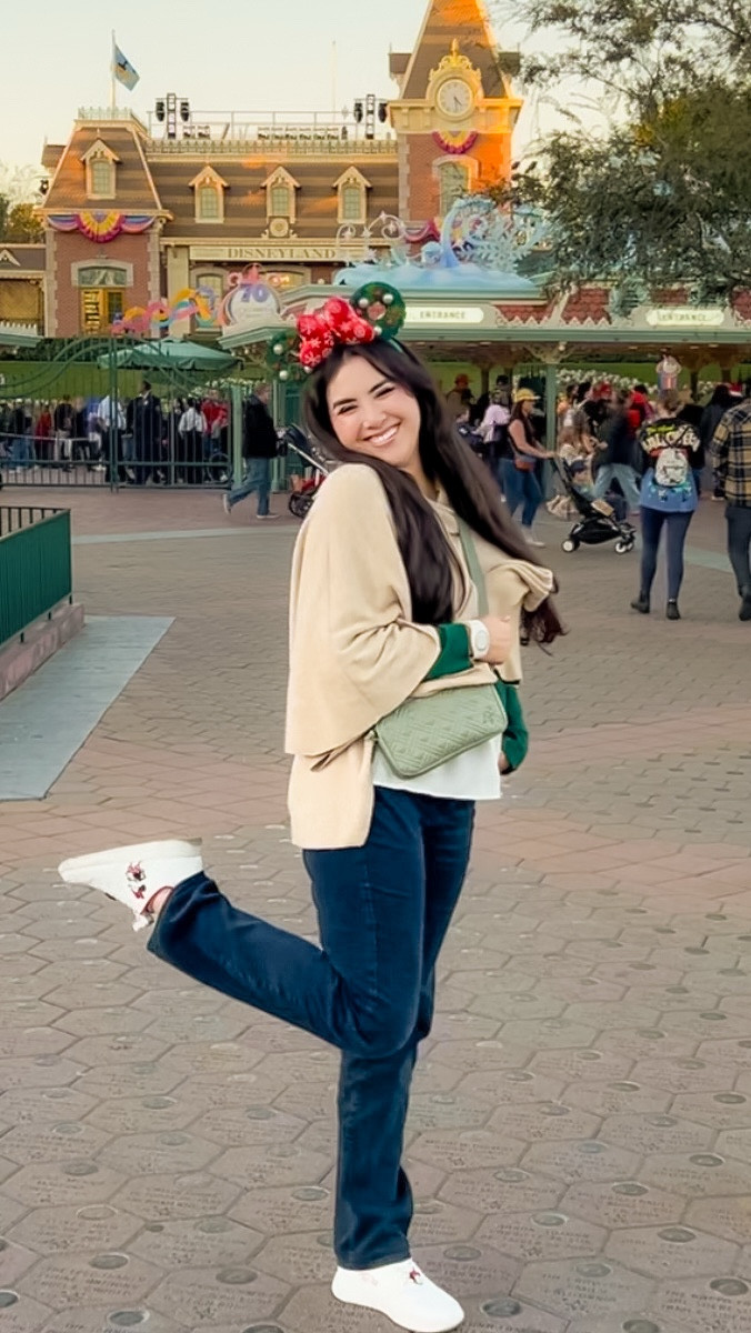 ✨ I love how a simple outfit can feel instantly elevated during the holiday season 🎄 This green long-sleeve dress shirt paired with a tan wrap sweater has such an effortless, chic look. 🥰

❤️It’s the kind of styling that feels polished without trying too hard, and it pairs so well with Disney holiday touches like gold Mickey jewelry and festive ears 

🐭 A subtle way to dress up and still lean into the season.

What is your favorite style to dress up when you’re traveling to a theme park? Casual, chic or super fandom coded? 🤗

Disney Christmas outfit, Disney holiday eras, Disney Christmas style, Disney gold jewelry, Angie’s magical style, Disney holiday gift ideas, colourpop, baublebar, holiday makeup 

#LTKootd #LTKHoliday #LTKSeasonal
