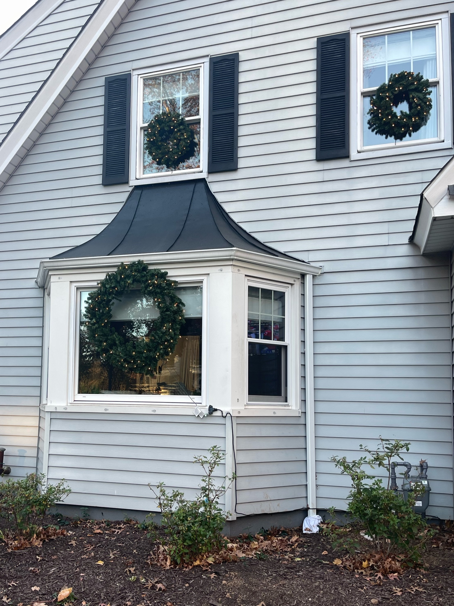 Pre-lit faux wreaths 50% off
