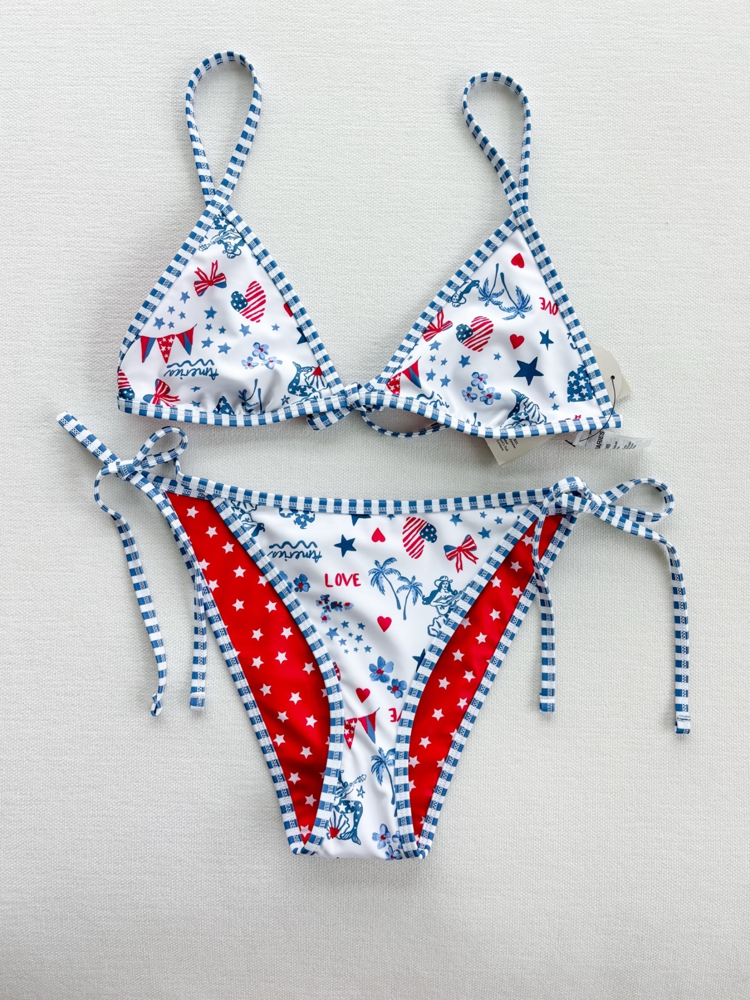 Obsessed with this!!! Got a M in both the top and bottom (I used another Walmart bikini for reference and it fits perfectly)! So perfect for Americana summer and the 4th!!! 

American summer
Americana summer
Patriotic swimsuits 
2026 swimsuits 
Cute cheap swimsuit 
Cute cheap bikini 
Cute swimsuit 
Cute bikini 
Roller rabbit
Roller rabbit dupe 
Stoney clover 
Stoney clover dupe 
Preppy 
Red white and blue 
Walmart find
Americana bikini
American flag bikini
Fourth of July bikini
4th of July swimsuit
Patriotic swimwear
USA bikini
Red white and blue bikini
Memorial Day swimsuit
Labor Day swimwear 
Summer patriotic outfit
Coquette bikini
Coastal coquette swimwear
Girly bikini
Cute string bikini
Triangle bikini
Tie side bikini
Vintage Americana
All American girl aesthetic
Cottagecore summer swim
Feminine swimwear
Beach vacation bikini
Summer beach outfit
Pool day bikini
Lake day swimsuit
Boat day outfit
Resort swimwear
Tropical vacation bikini
Beach club outfit
Coastal granddaughter style
Hamptons summer style
Blue and white bikini
Red white blue swimsuit
Star print bikini
Heart print bikini
Gingham trim bikini 
Printed triangle bikini
Cute patriotic print
Preppy swimwear
Americana print swimsuit
Novelty print bikini
Summer 2026 swimwear
Viral bikini
LTK summer finds 
Vacation must haves
Amazon bikini dupe
Designer inspired swimwear
Beach essentials
Summer outfit inspiration
Trending swimwear
Coastal summer style
Cute red white and blue bikini
Patriotic bikini for Fourth of July
Coquette Americana swimsuit
Preppy patriotic swimwear
String bikini with tie sides
Coastal cowgirl beach outfit
Hamptons inspired swimwear
Old money beach aesthetic
Americana beach girl style
Fourth of July pool party outfit

#LTKSwim #LTKMidsize #LTKPetite #LTKootd #LTKSwim #LTKTravel