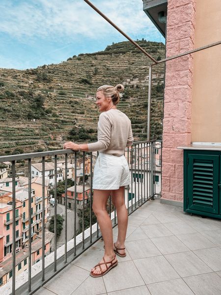 Classic neutrals in this colorful town 😍 wore this easy combo for breakfast in the hotel. 

I’m in a small sweater & size 2 shorts  

#LTKOver40 #LTKTravel