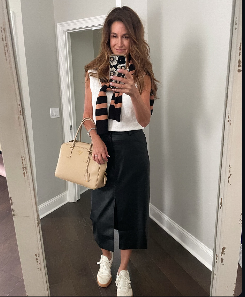 Fall in Florida means dressing for 82° and still trying to look seasonal! Today, it’s a faux leather midi skirt, a tee, and a cardigan draped over my shoulders (because, heat 🥵) i love that sneakers/tennis shoes are still on trend—comfy, easy, and I wear mine with everything.

#fallinflorida #falltrends #styleover50 #fashionover40 #midlifestyle #casualoutfits #ootd #fauxleather 
