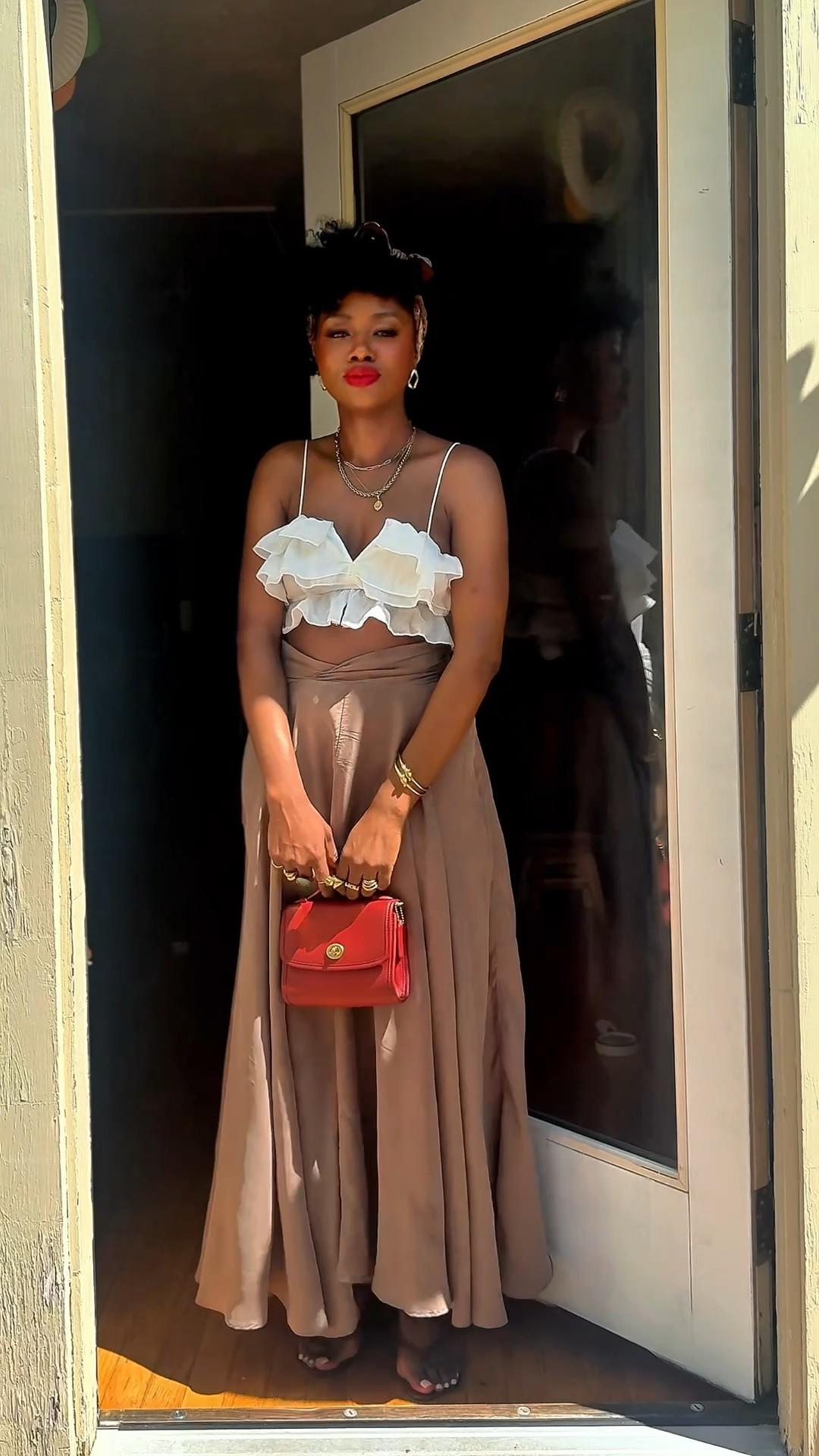 Soft neutrals, flowy skirts, gold jewelry, and a vintage inspired red bag will always have me in a chokehold. This felt like the perfect elevated spring to summer outfit for walking around Boston. Summer outfit.

Wearing a ruffle crop top with a satin maxi skirt, layered gold jewelry, and metallic sandals for an effortless feminine look that still feels comfortable and wearable.

#LTKStyle #SpringOutfit #MaxiSkirtOutfit #NeutralStyle #FeminineStyle #FashionOver40 #BostonStyle

#LTKOver40 #LTKOver40 #LTKSeasonal