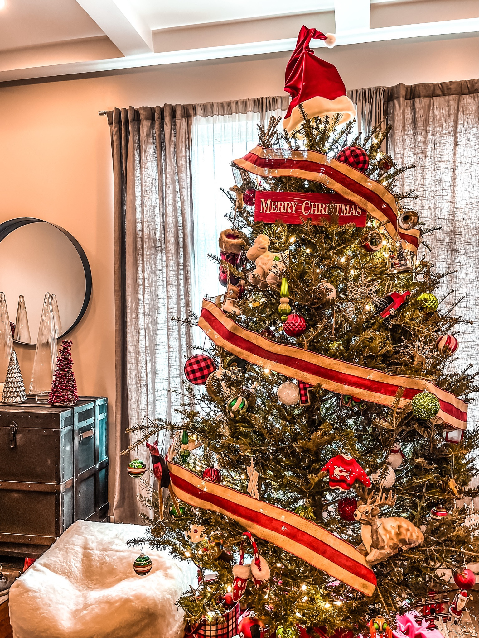 Traditional Christmas Tree
- extra large ornaments
- bottlebrush ornaments 
- mercury glass ornaments
- glass cloche tree
- Sherpa large ottoman/puff 
- bar storage trunk 
- tree topper
#ltkcyberweek #ltkhome #ltksalealert

#LTKHoliday #LTKSeasonal #LTKGiftGuide