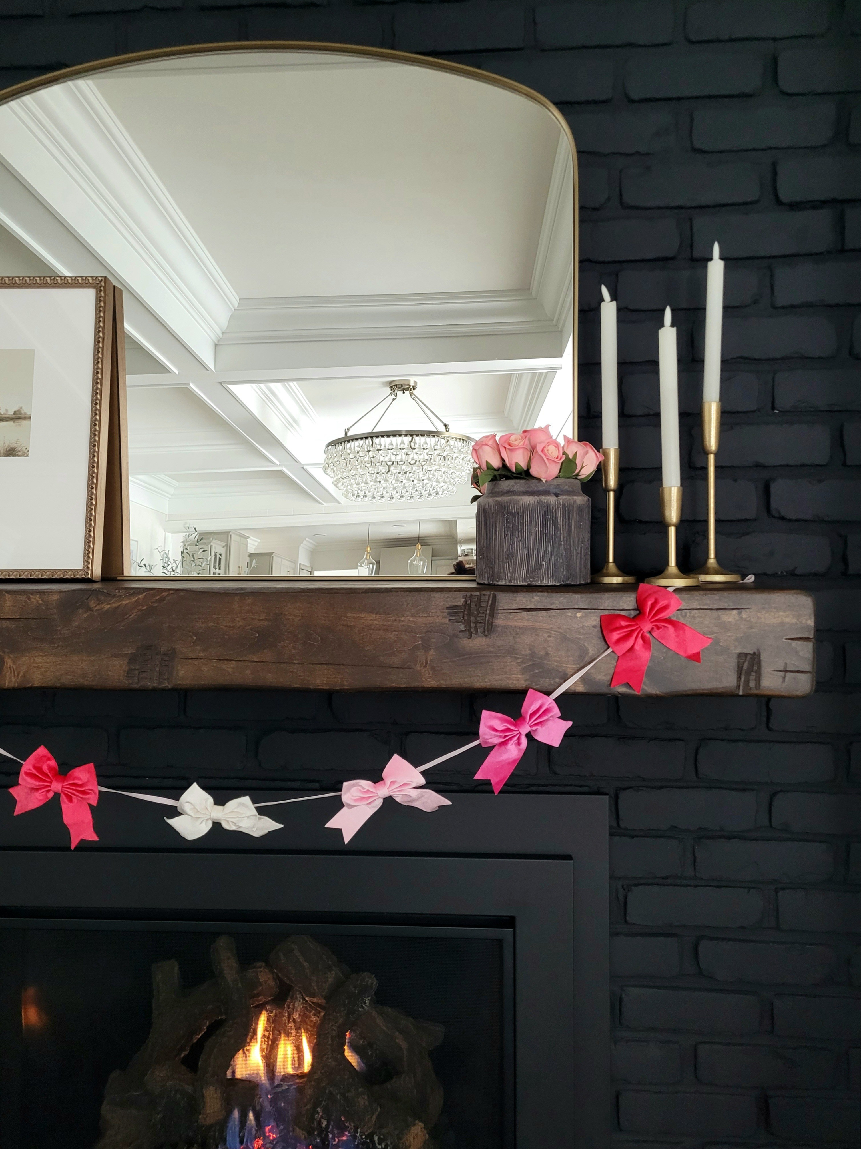 Valentine's Day decor - the sweetest bow garland and real touch faux roses perfect for the fireplace mantle! Only $15 for both! 

#LTKValentine #LTKHome