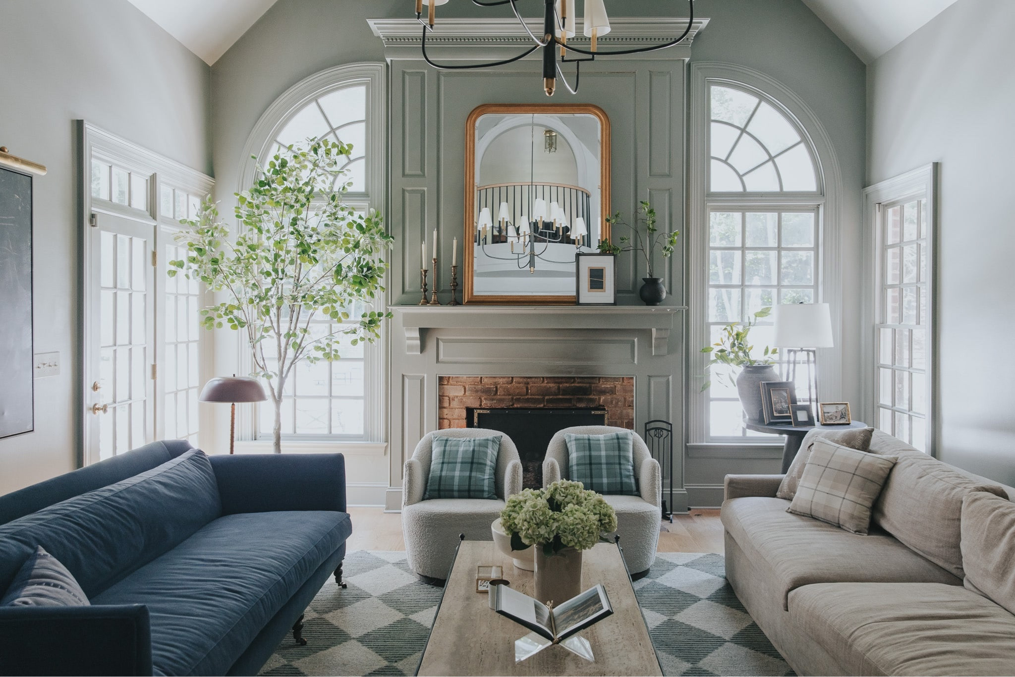 Transitioning your home to warmer months… today on Chris Loves Julia.com! 

Velvet blue sofa, linen sofa, boucle swivel chairs, coffee table, books, vase, hydrangeas, brass mirror, lamp, Francis area rug

#LTKSeasonal #LTKhome