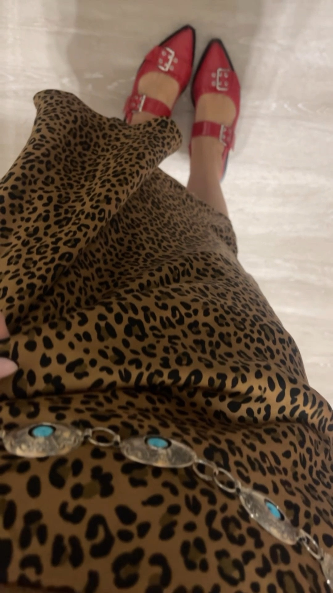 Rebuild this outfit with me. 
Graphic tshirt
Band shirts
Oversized shirts
Leopard print
Leopard print skirt
Red shoes
Women’s red flats
Shoe dupes
Bangles
Bracelets
Chunky bracelet 
Brunch outfit
Girls night out 
Concho belt
Western belt 
