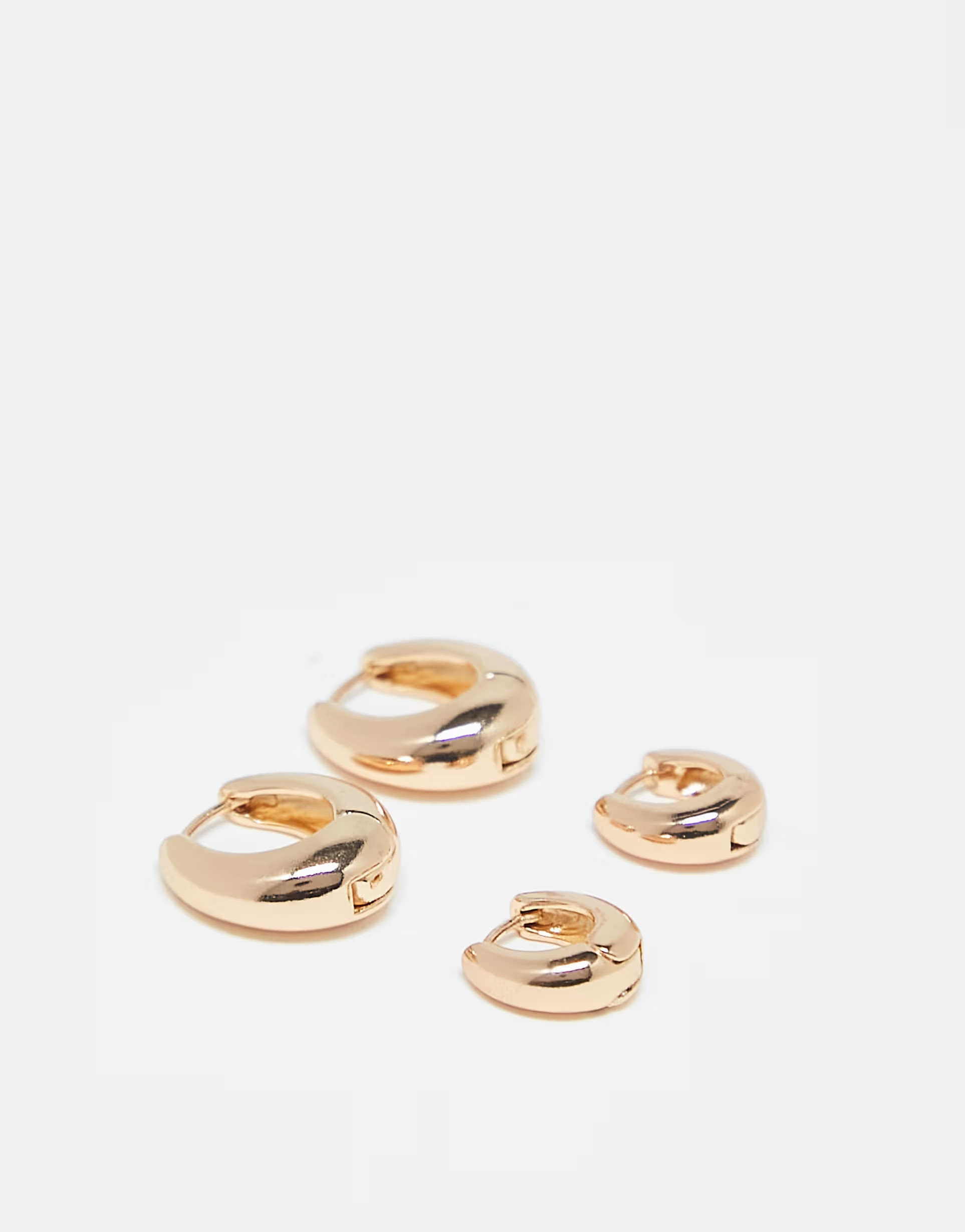 ASOS DESIGN pack of 2 hoop earrings with graduating hinge design in gold tone | ASOS (Global)