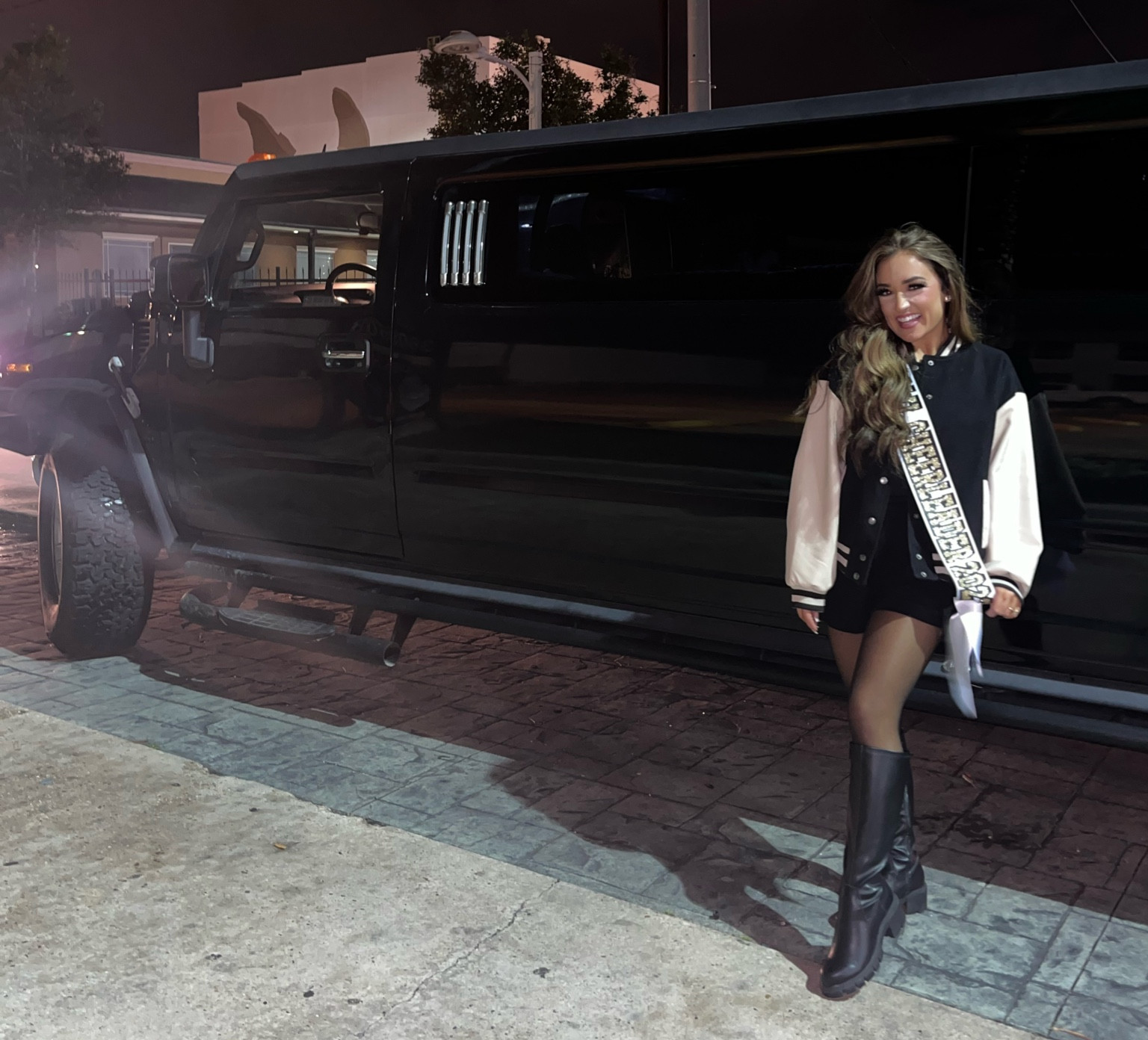 Black leather knee high boot, letterman jacket - discontinued color I’m wearing but linked others