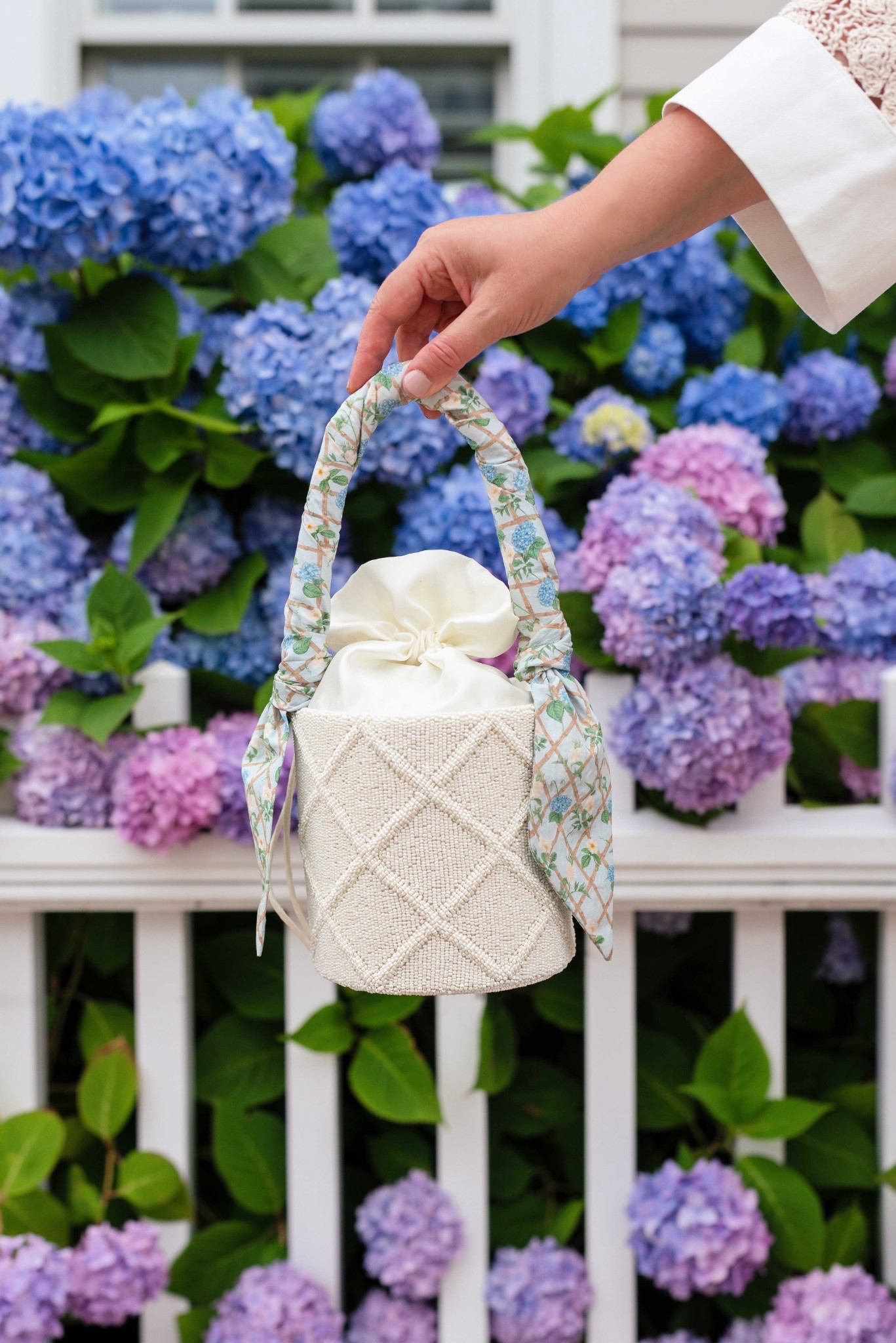 Your next favorite summer bag for dinners and special nights out. This petite bucket bag holds your phone and essentials. Handmade and a custom floral print on the detachable silk scarf.

#LTKItBag #LTKSeasonal #LTKParties