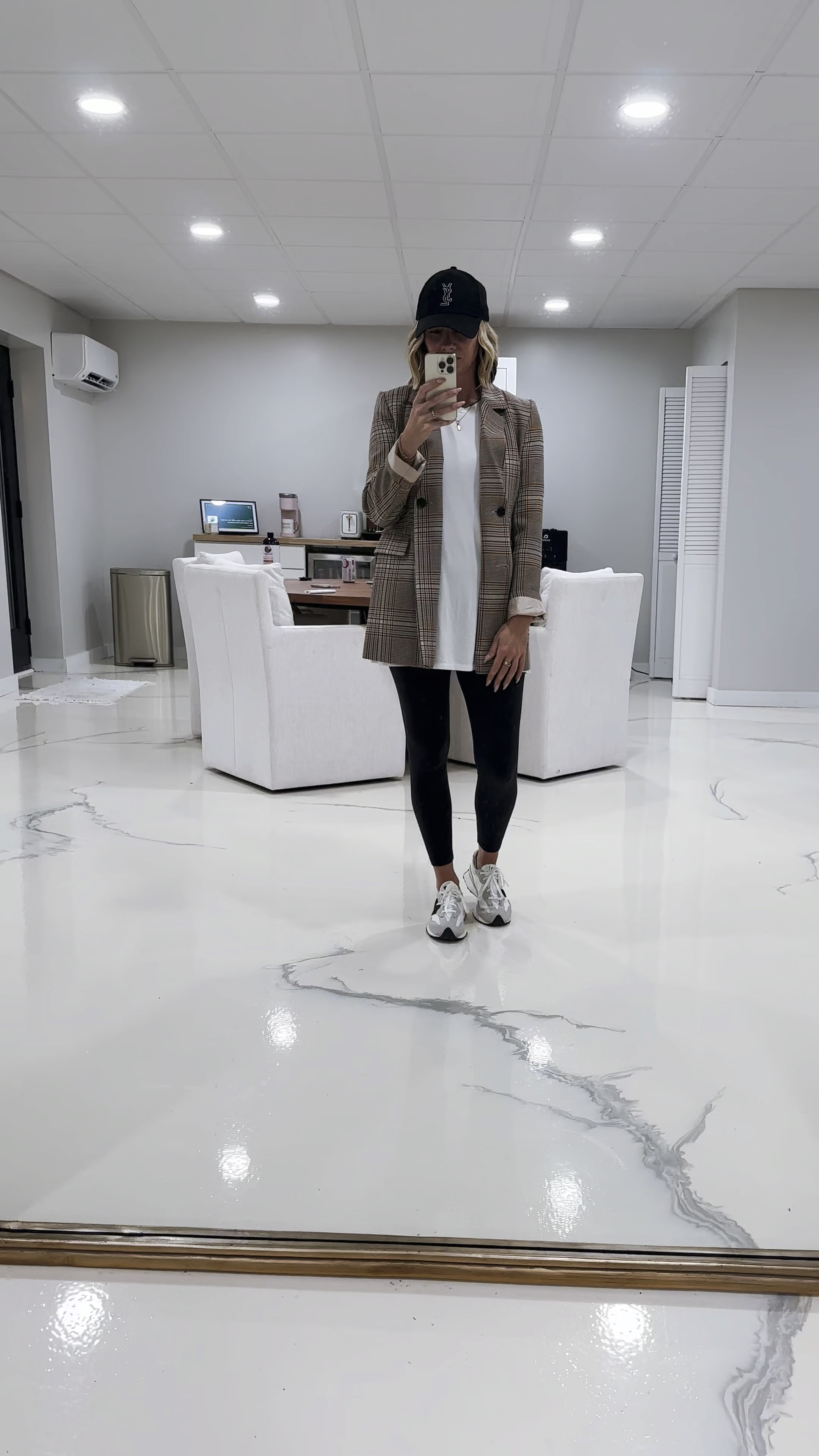 Rainy day mom on the go outfit. 

Fashionably late mom
Fall outfits
Black leggings
New balance 327
Oversized blazer 
Baseball cap 