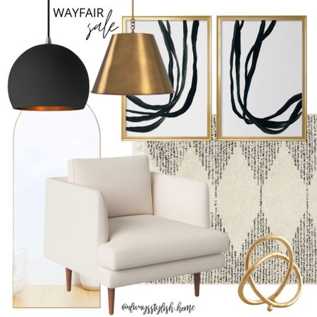 modern wall art, black cream rug, cream accent chair. Gold figurine, gold pendant light, black pendant light, arch top mirror

#LTKhome